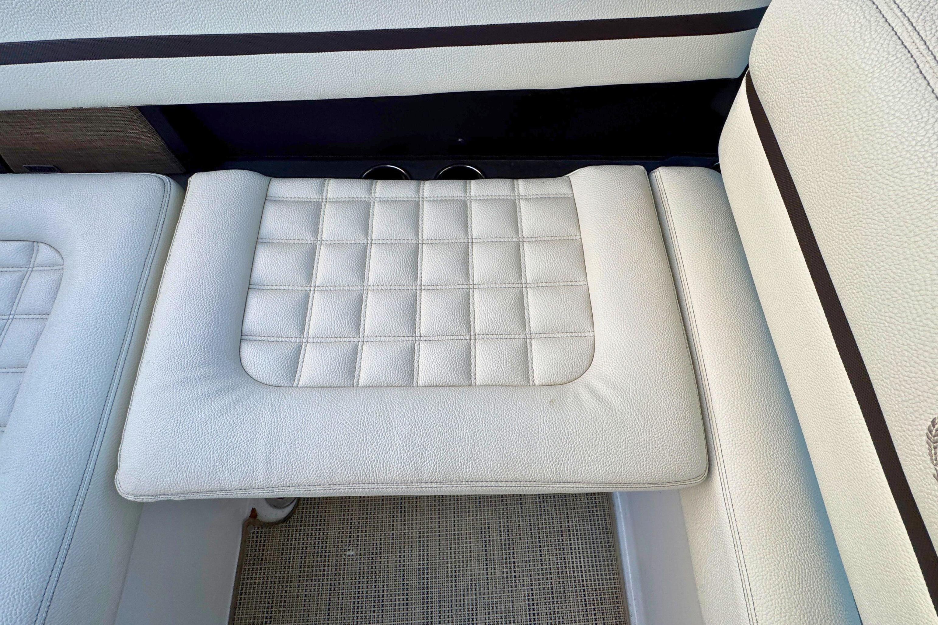 2019 Cobalt R3 boat interior with white cushioned seating and textured design.