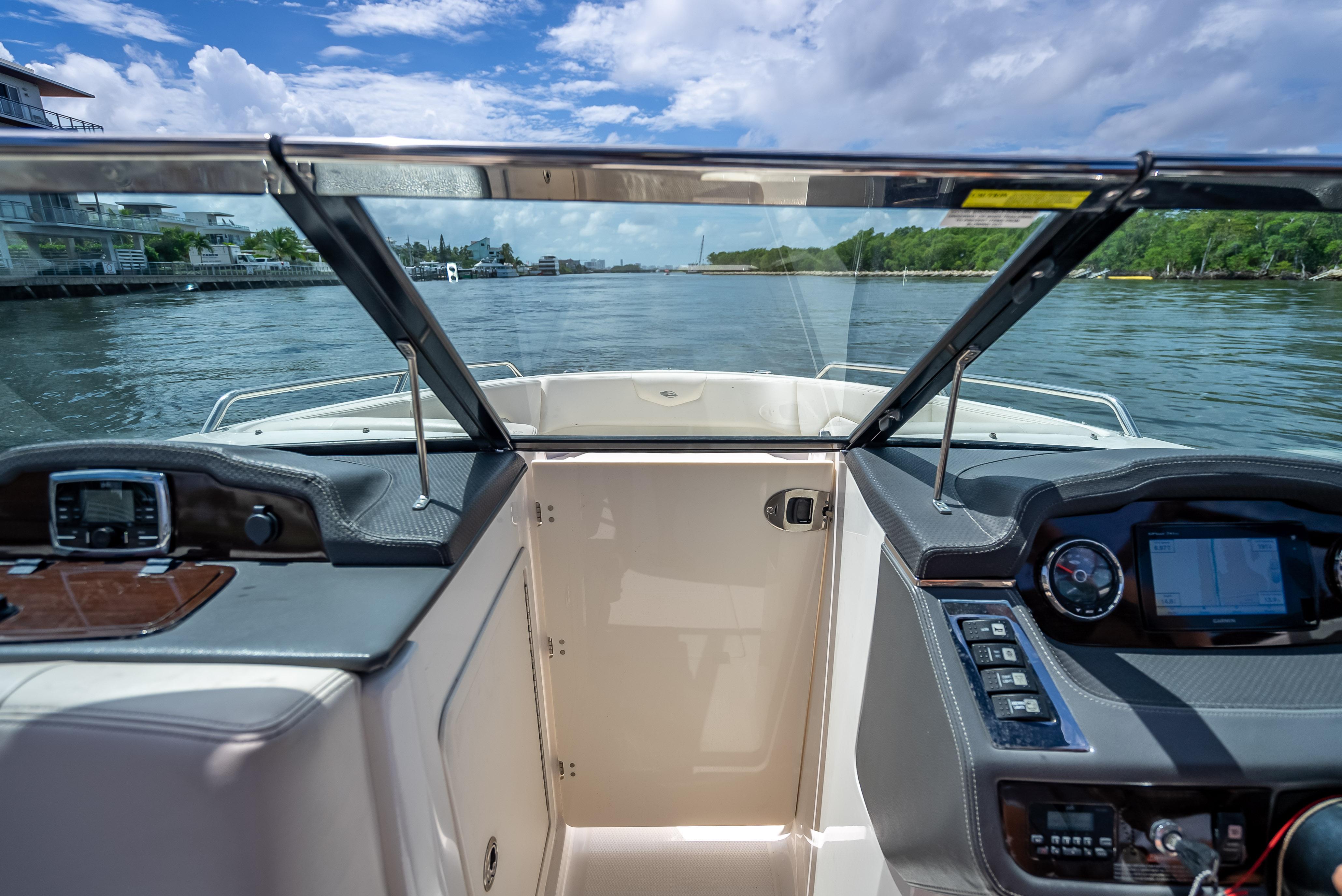 2017 Chaparral 227 SSX boat interior with dashboard and water view.