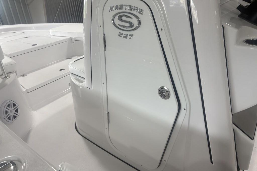 2026 Sportsman Masters 227 boat interior with sleek white design and seating.