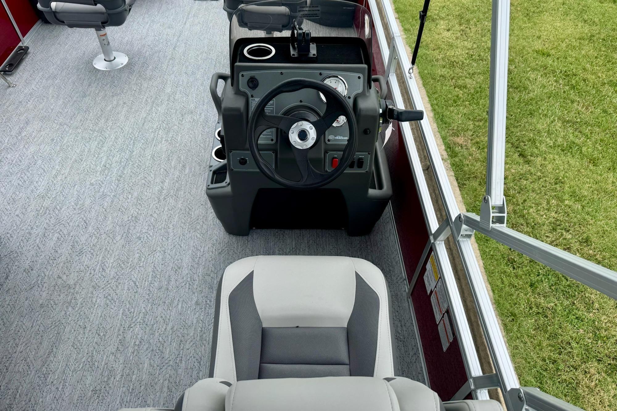 2026 Sun Tracker Bass Buggy 18 DLX interior with steering console and seating.