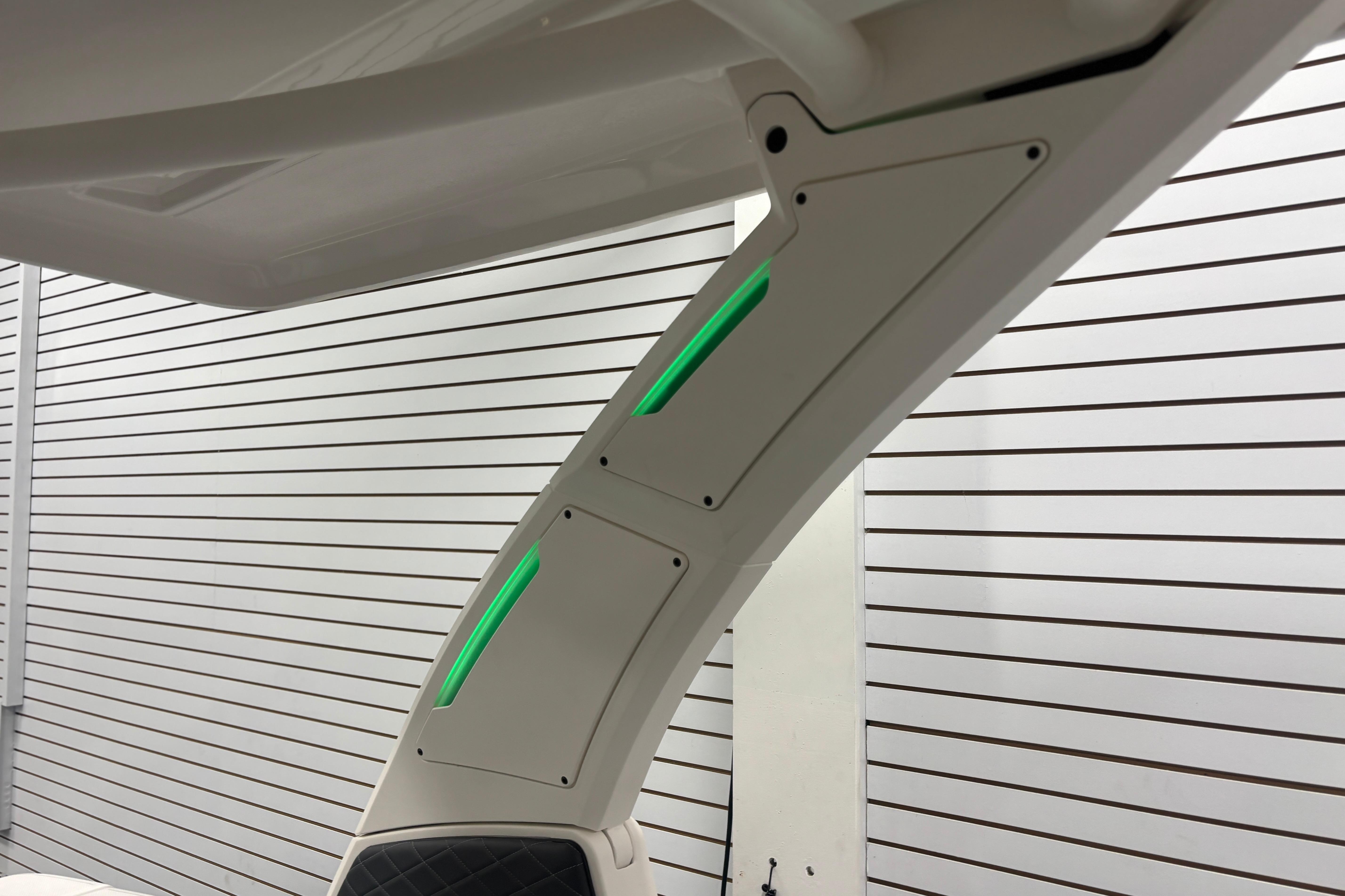 2026 Chaparral SSX 30 boat detail with sleek design and green LED accents.