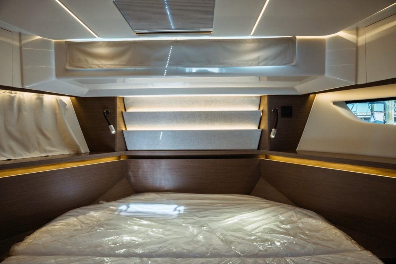 Luxurious interior cabin of the 2026 Jeanneau NC 1295 Fly yacht, featuring modern design elements.