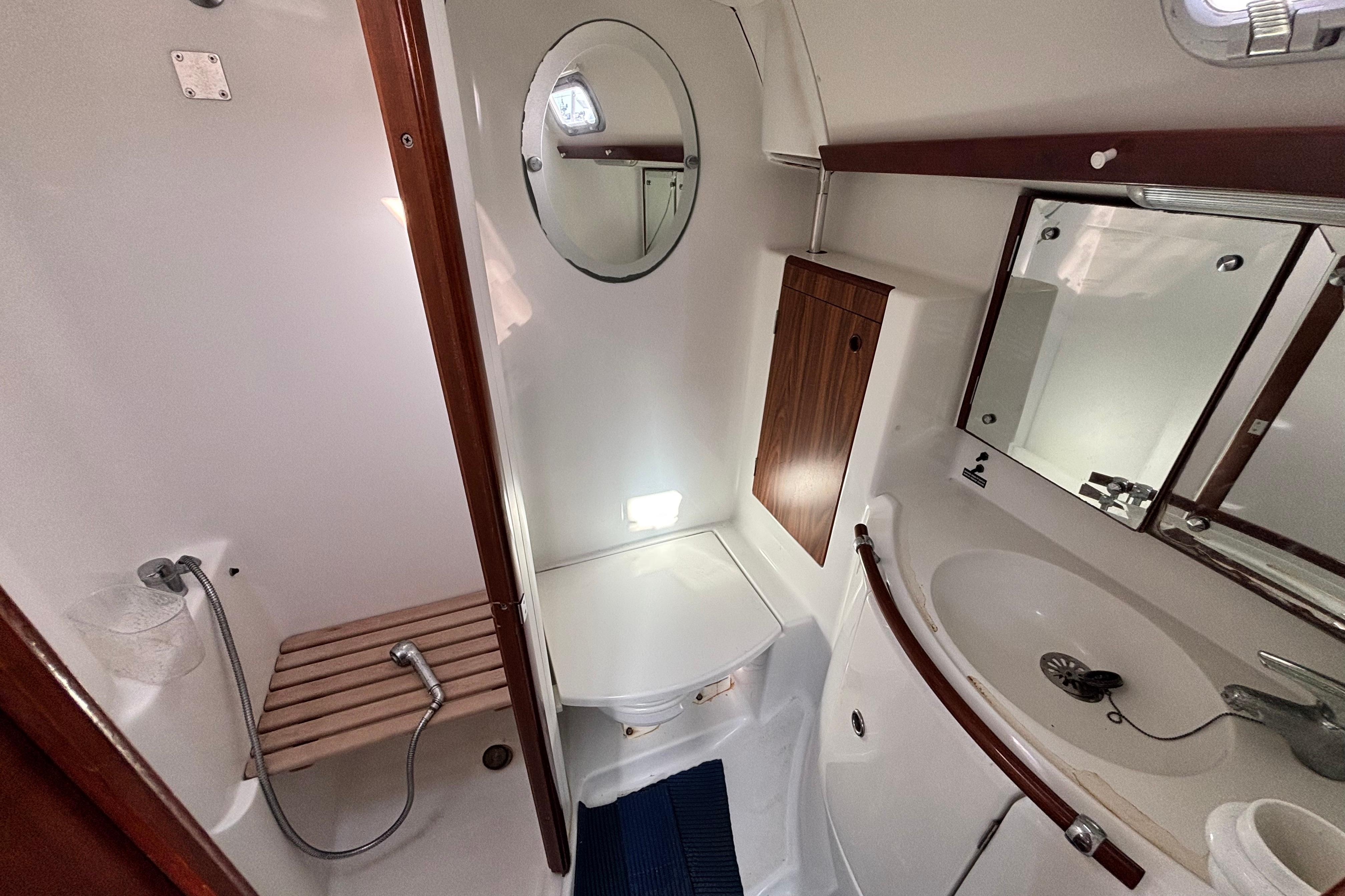 Bathroom interior of a 2005 Beneteau 50 yacht, featuring a shower and sink.