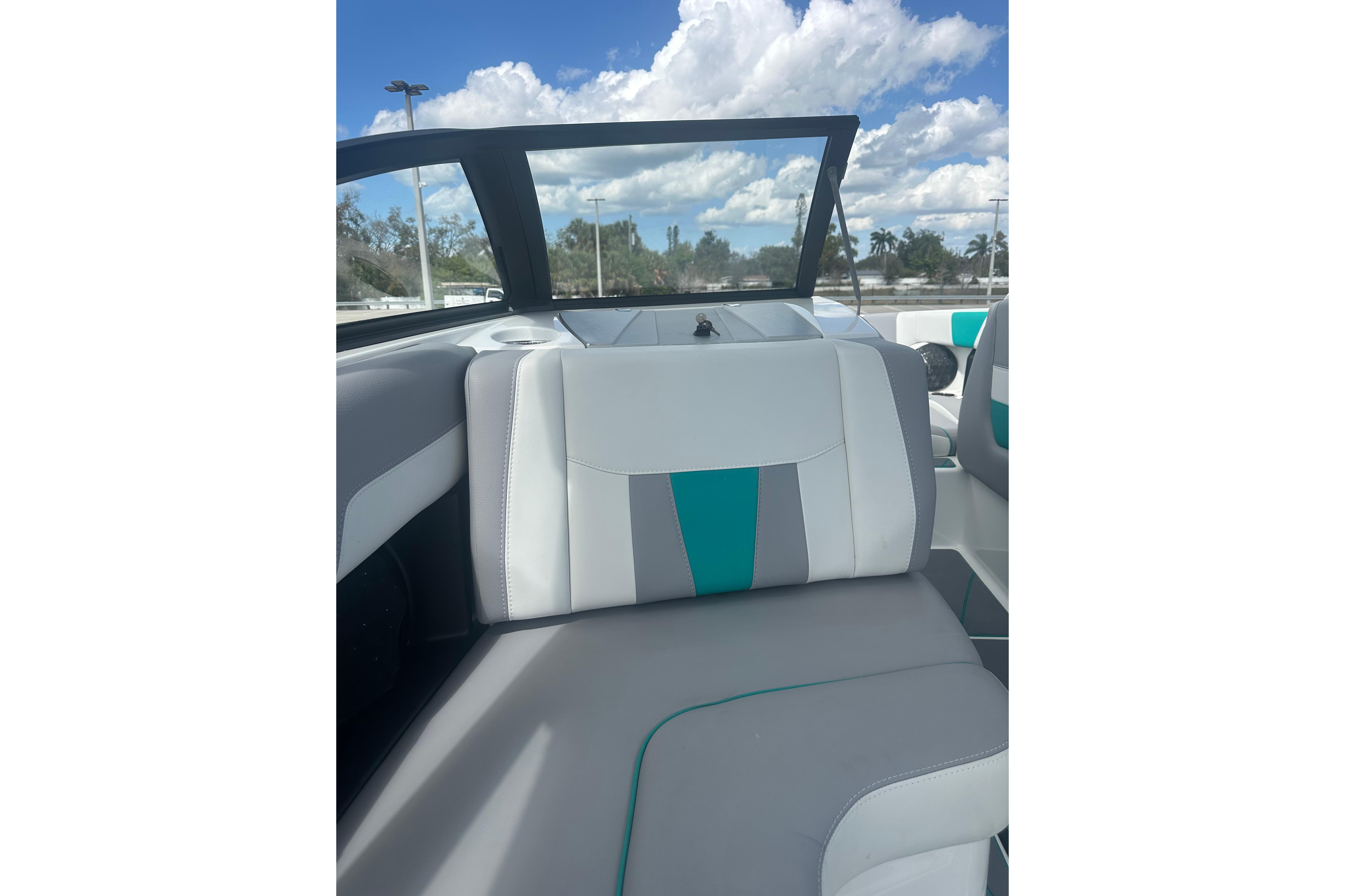 2022 Malibu Wakesetter 23 LSV interior with stylish seating under a blue sky.