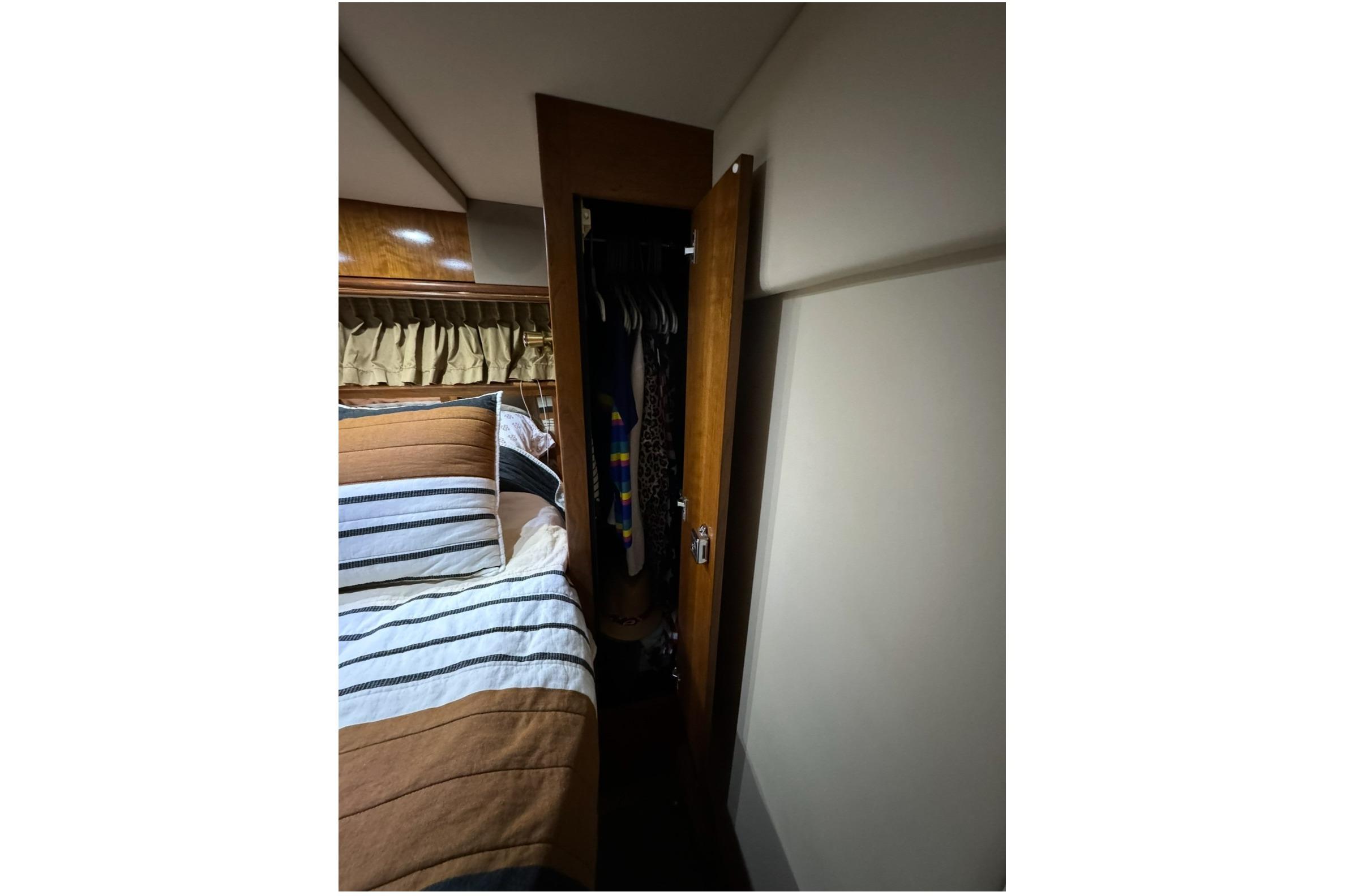 Interior of 2003 Cruisers Yachts 4370 Express with bed and closet.