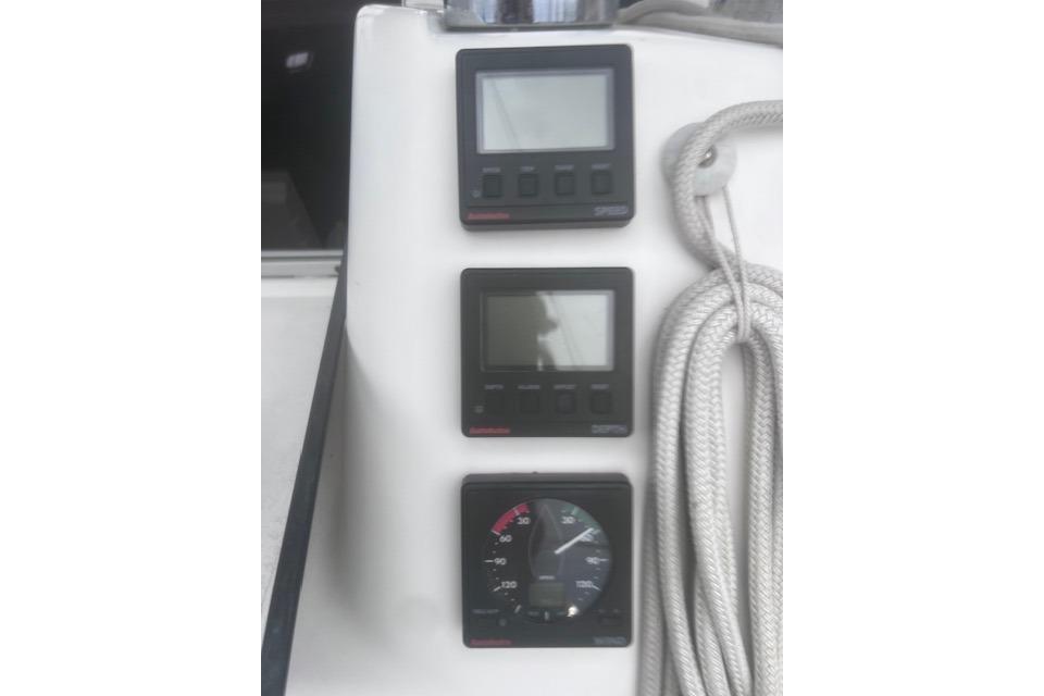 Control panel of 1996 Hunter 37.5 Legend sailboat with navigation instruments and rope.