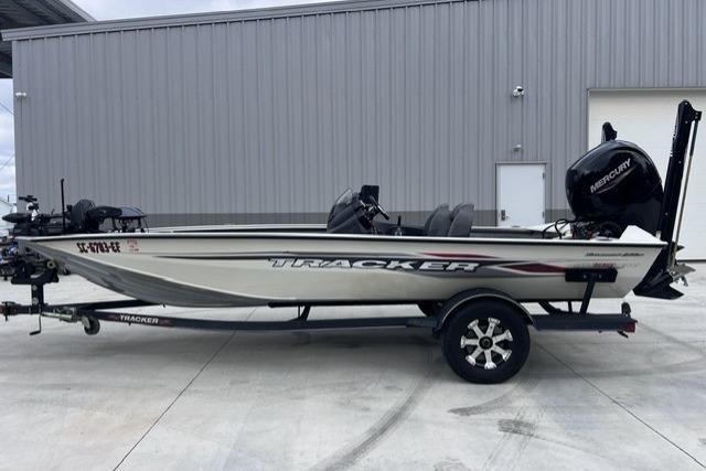 2021 Tracker Pro Team 195 TXW Tournament Edition boat on trailer, parked outside a building.
