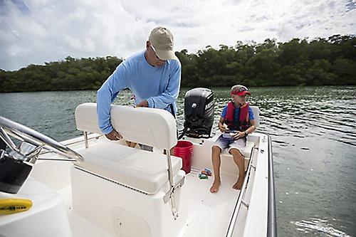 2026 Boston Whaler 170 Montauk boat on water with two people onboard.