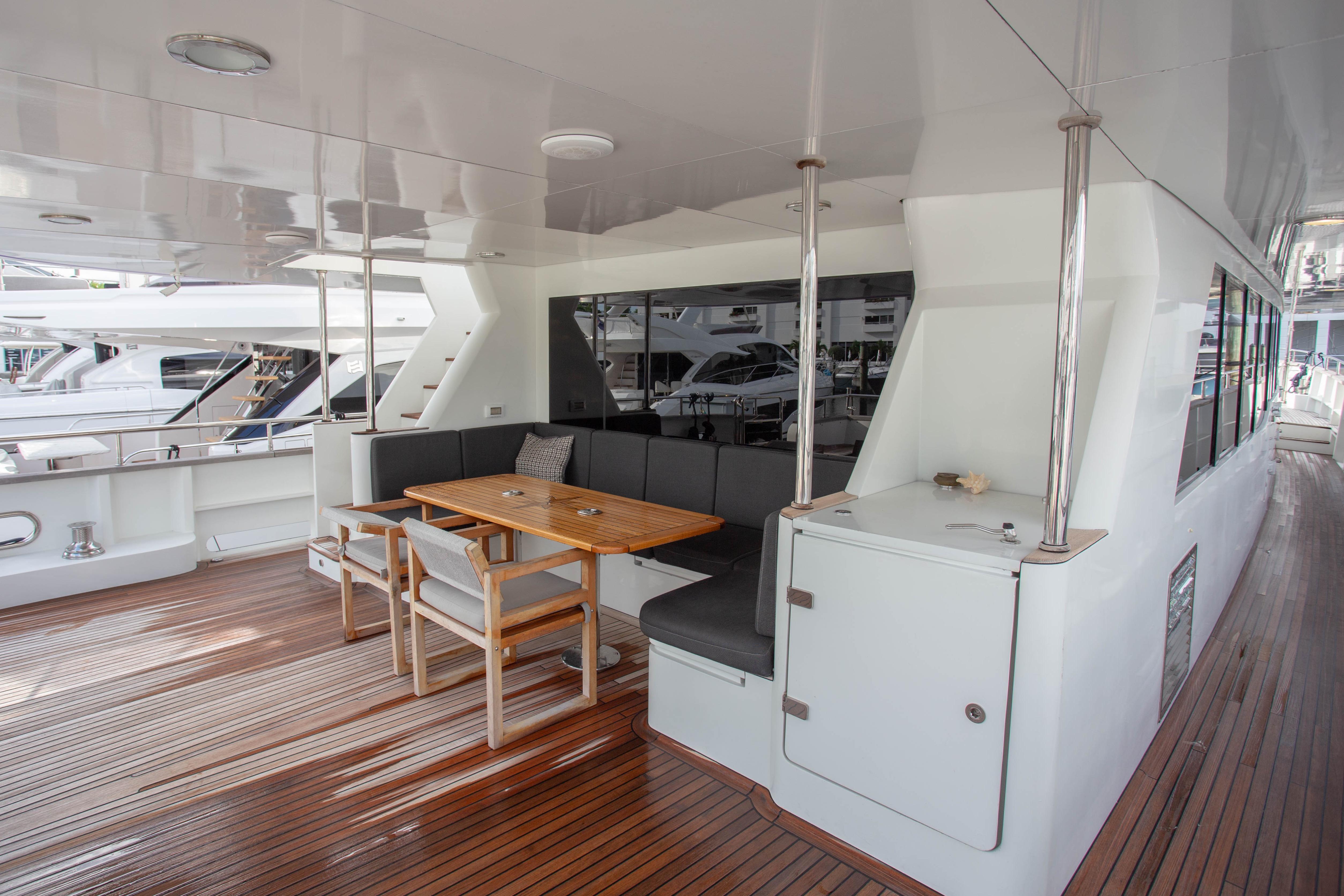 Luxurious deck seating area on 2014 Fifth Ocean Yachts 24m Explorer Yacht.