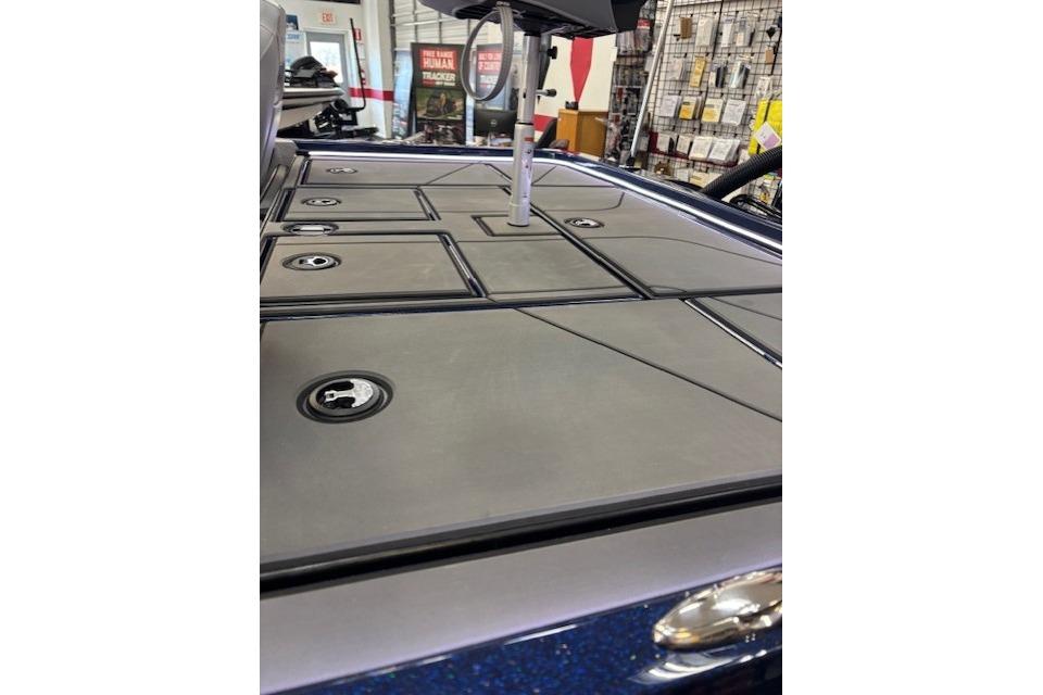 2026 Nitro Z19 XL boat deck with storage compartments in showroom.
