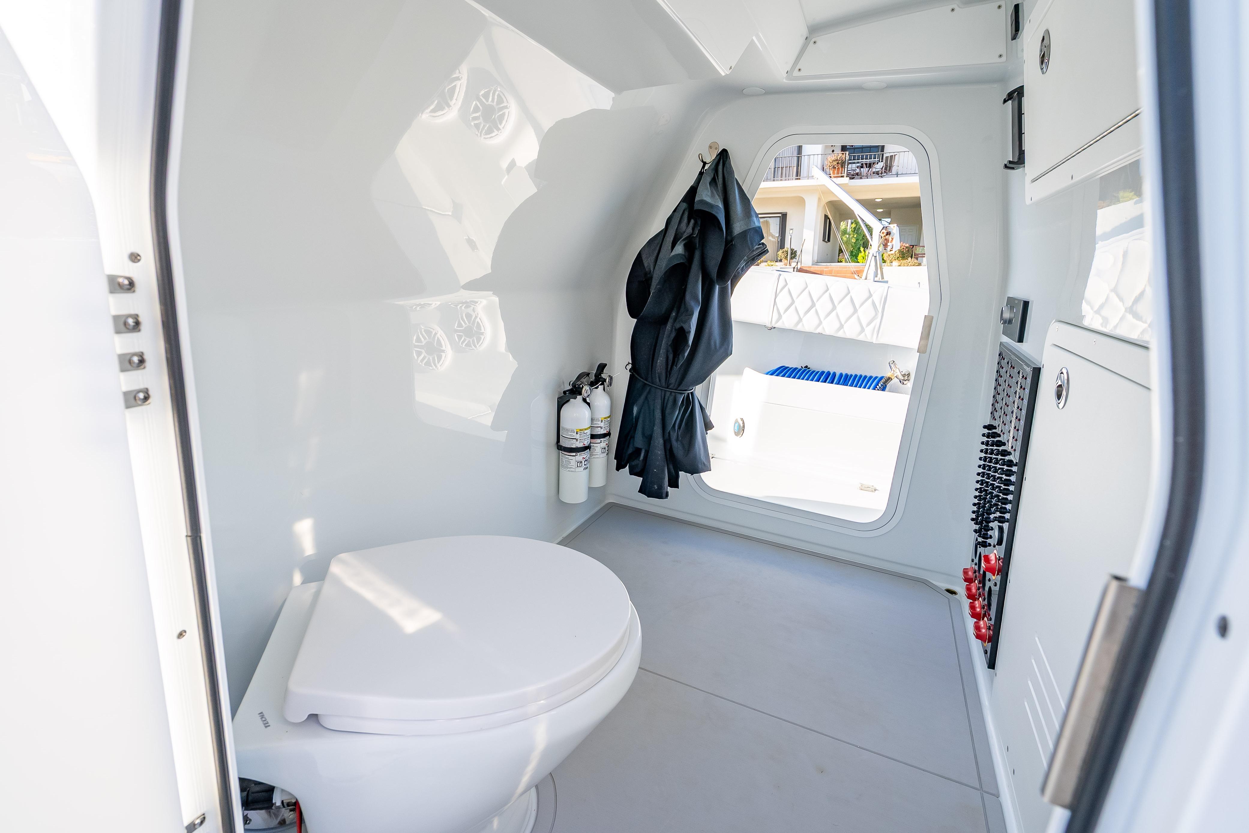 Modern bathroom interior on 2026 Freeman 35 boat, featuring sleek design and essential amenities.