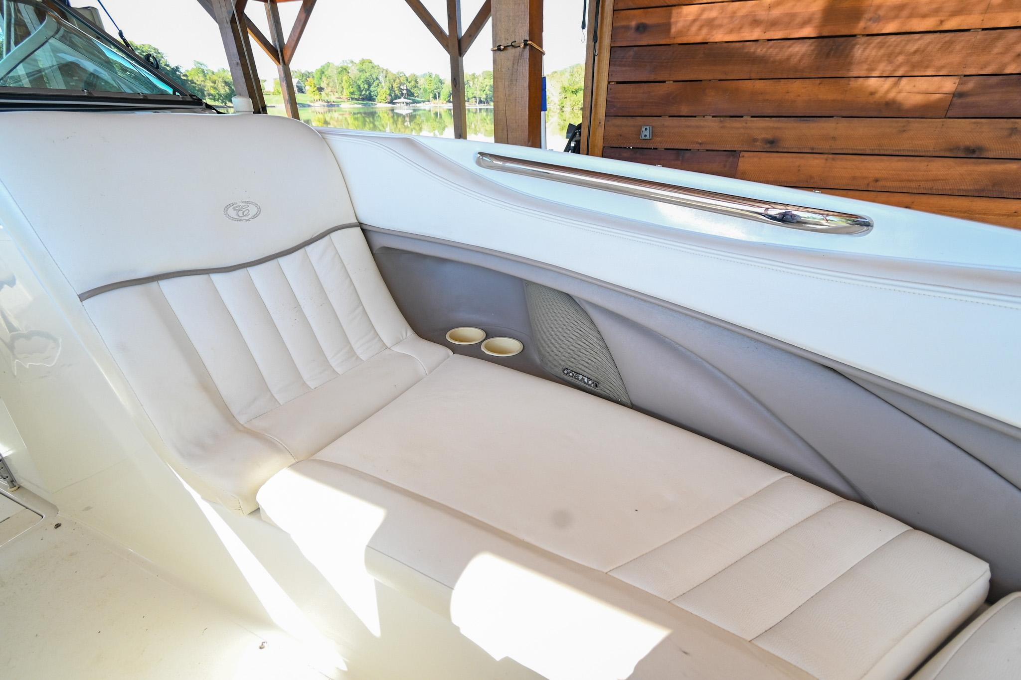 2002 Cobalt 262 boat interior with white leather seating and cup holders.
