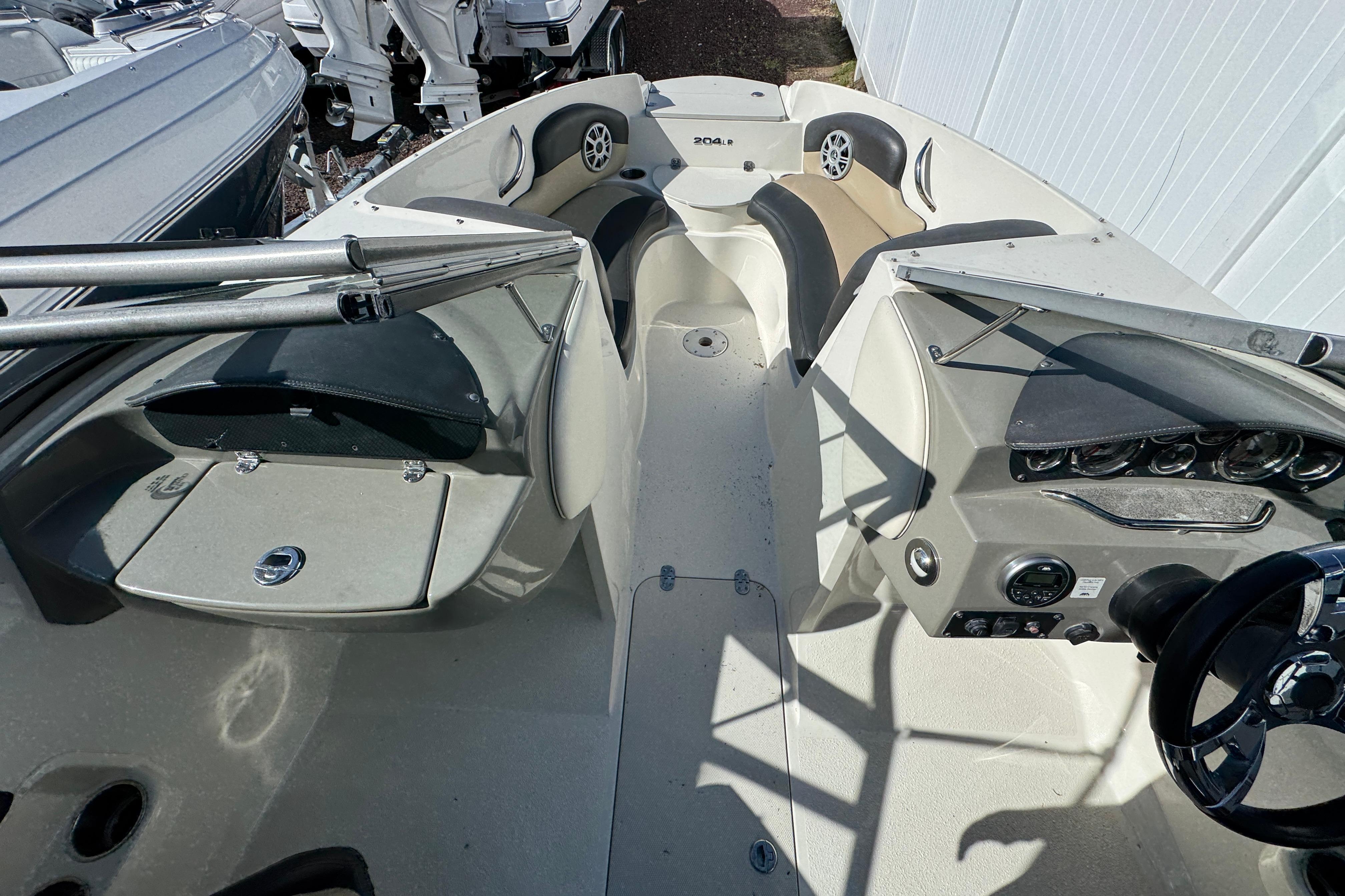 2018 Stingray 204 LR boat interior with seating, dashboard, and steering wheel.