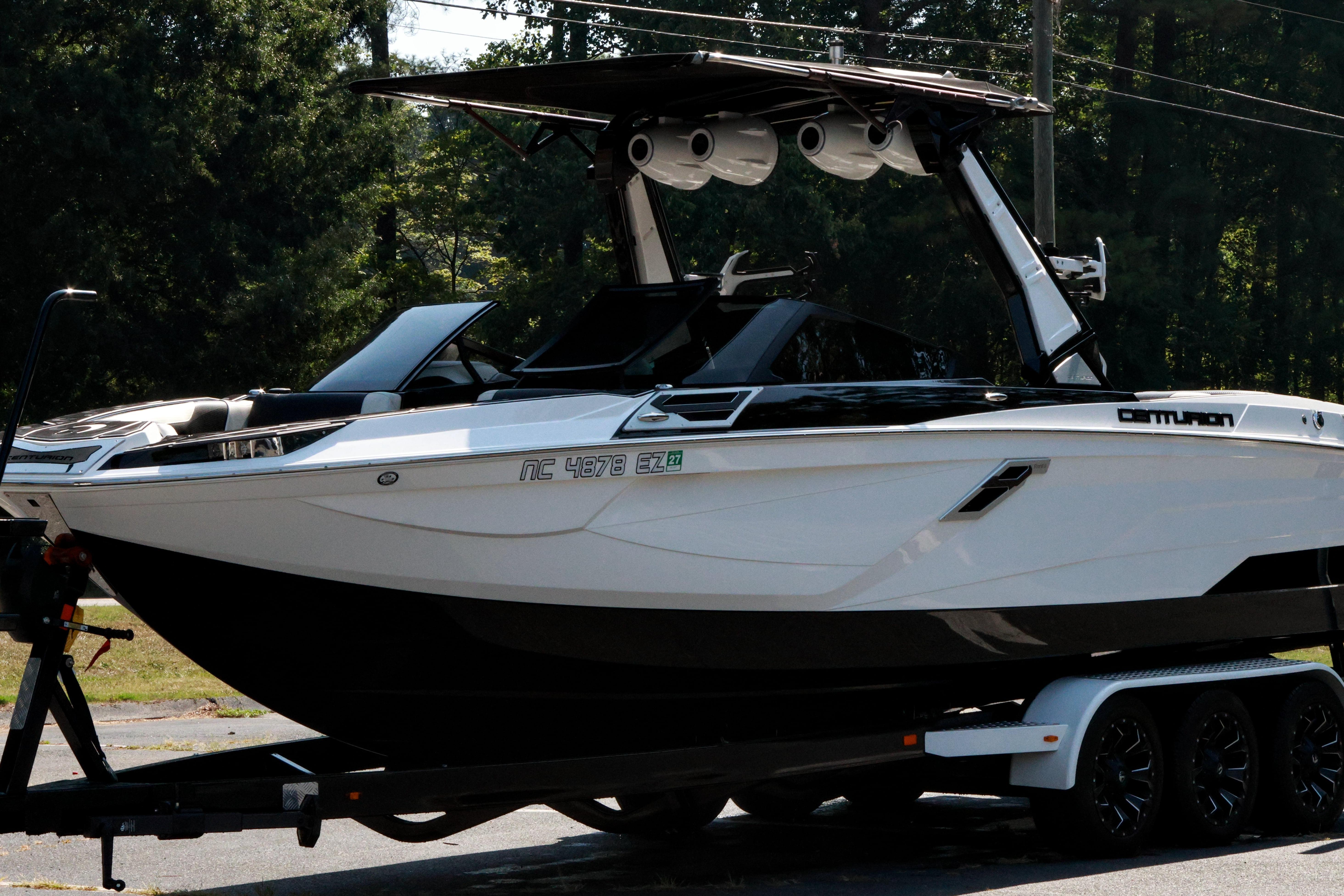 2022 Centurion Ri265 boat on trailer, parked outdoors.
