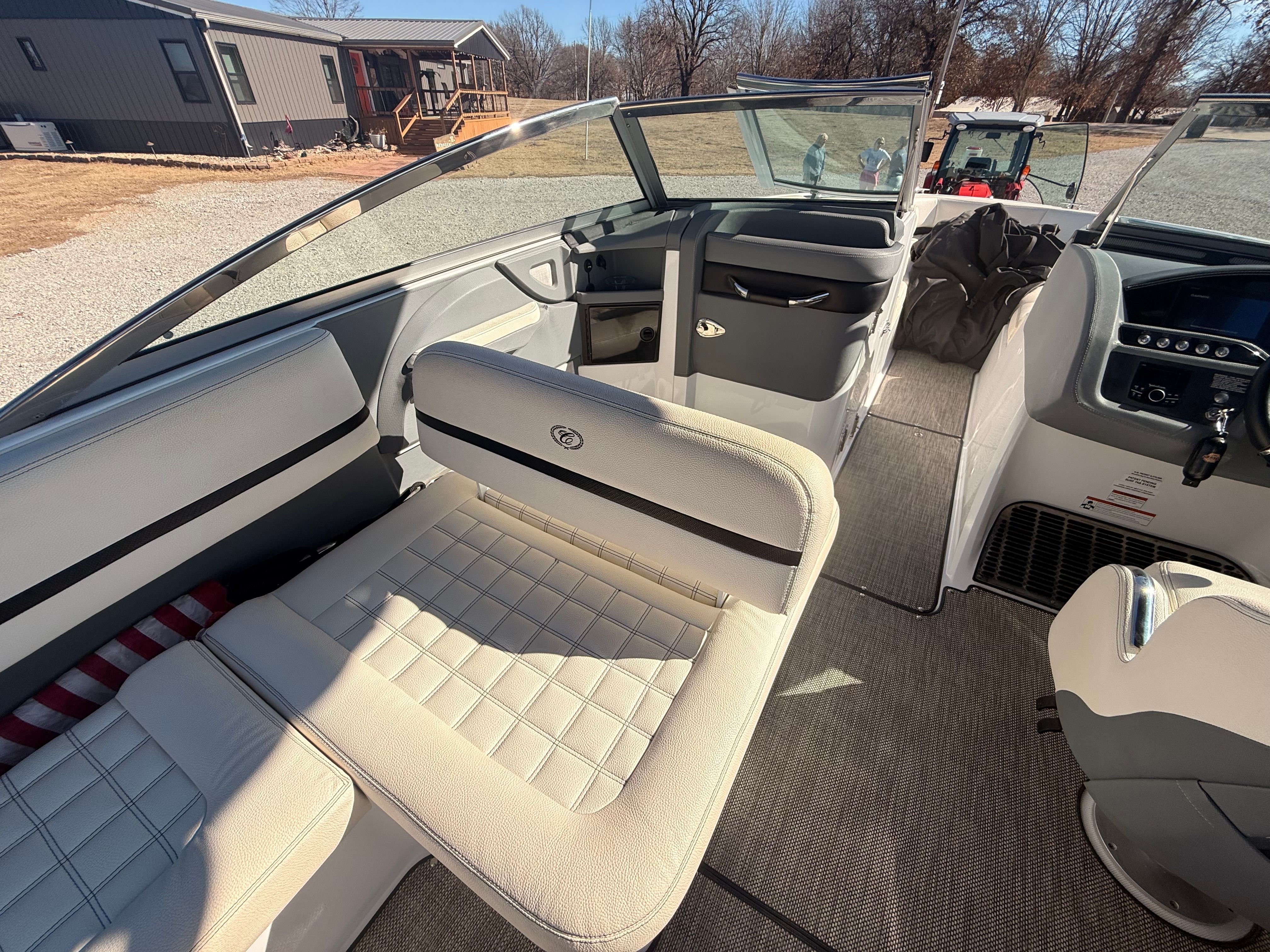 The image shows the interior of a 2019 Cobalt R7 Surf boat with beige seating.