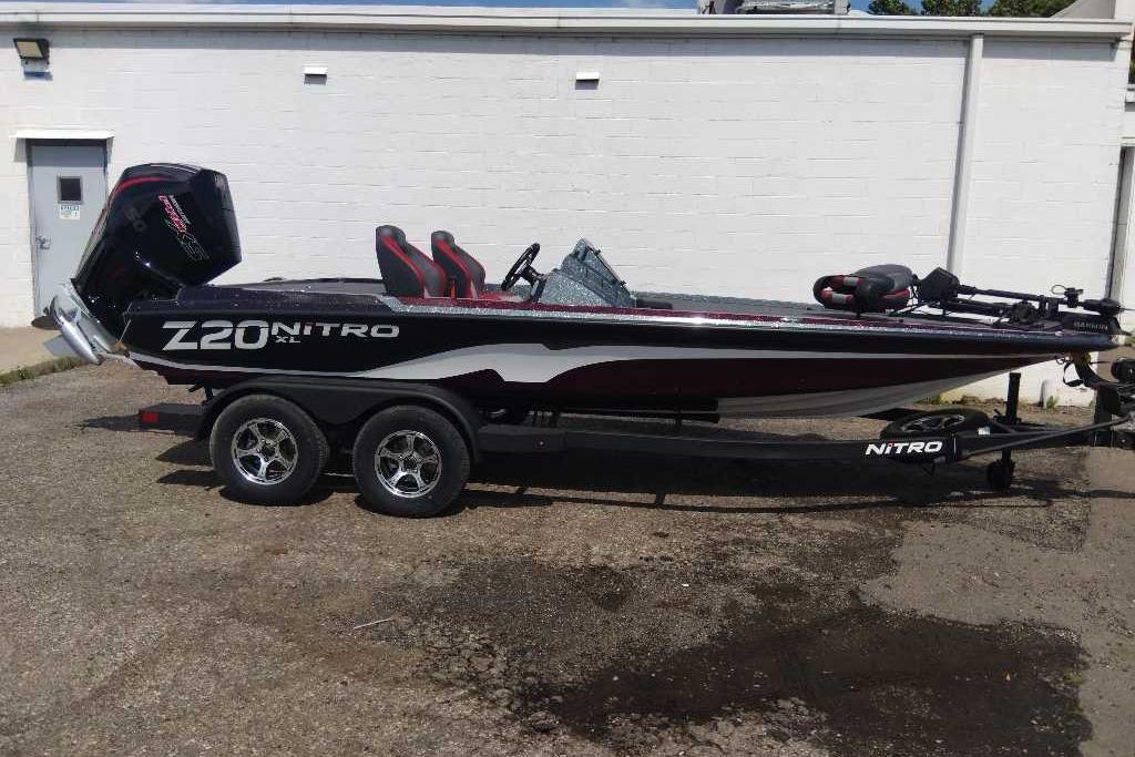2026 Nitro Z20 XL Pro boat on trailer, parked outdoors, side view.