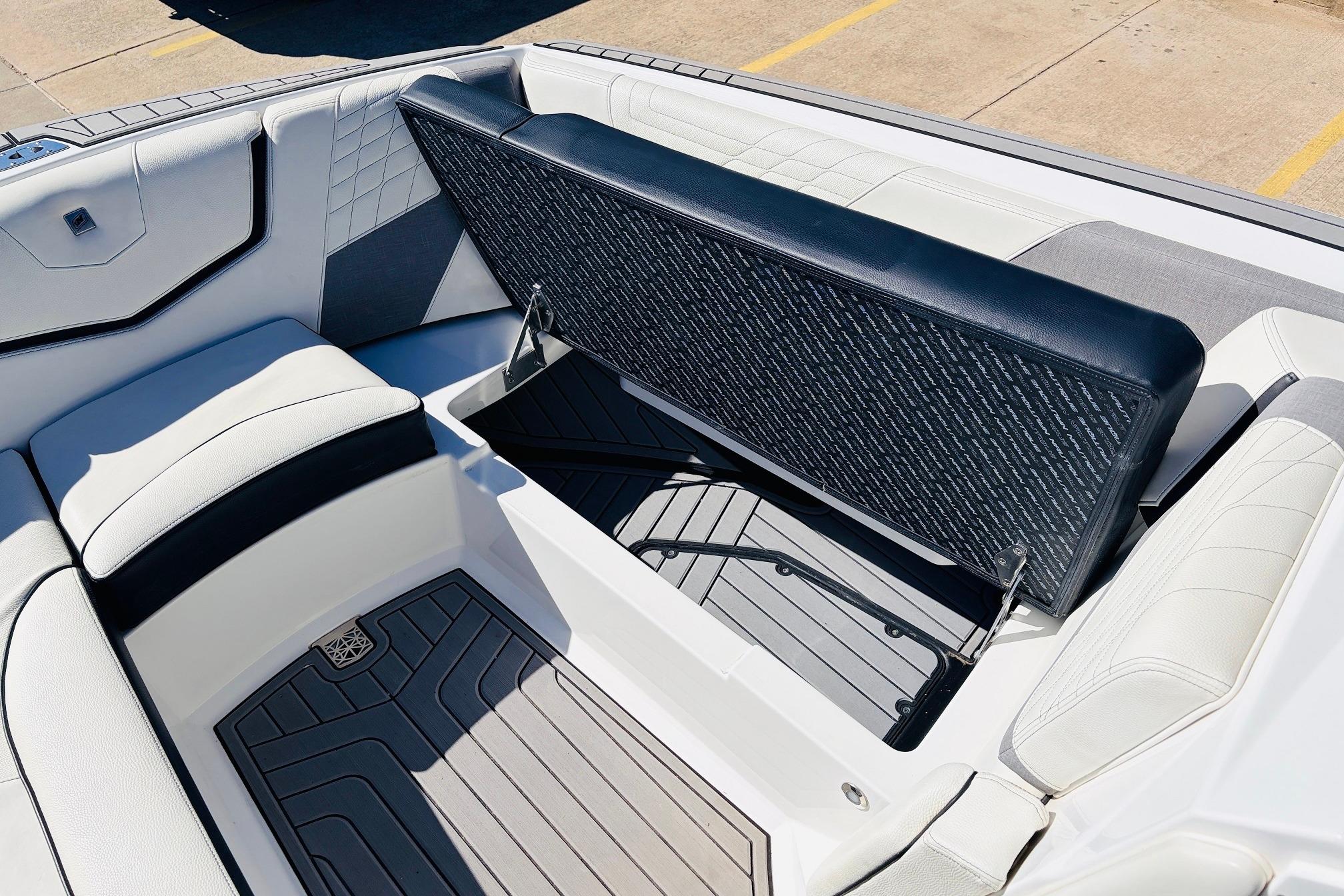 2023 Nautique Super Air Nautique G25 interior with open storage compartment.