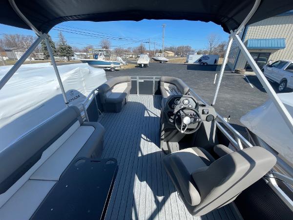 2025 Armada Saphir 23CR pontoon boat interior with seating and steering console.