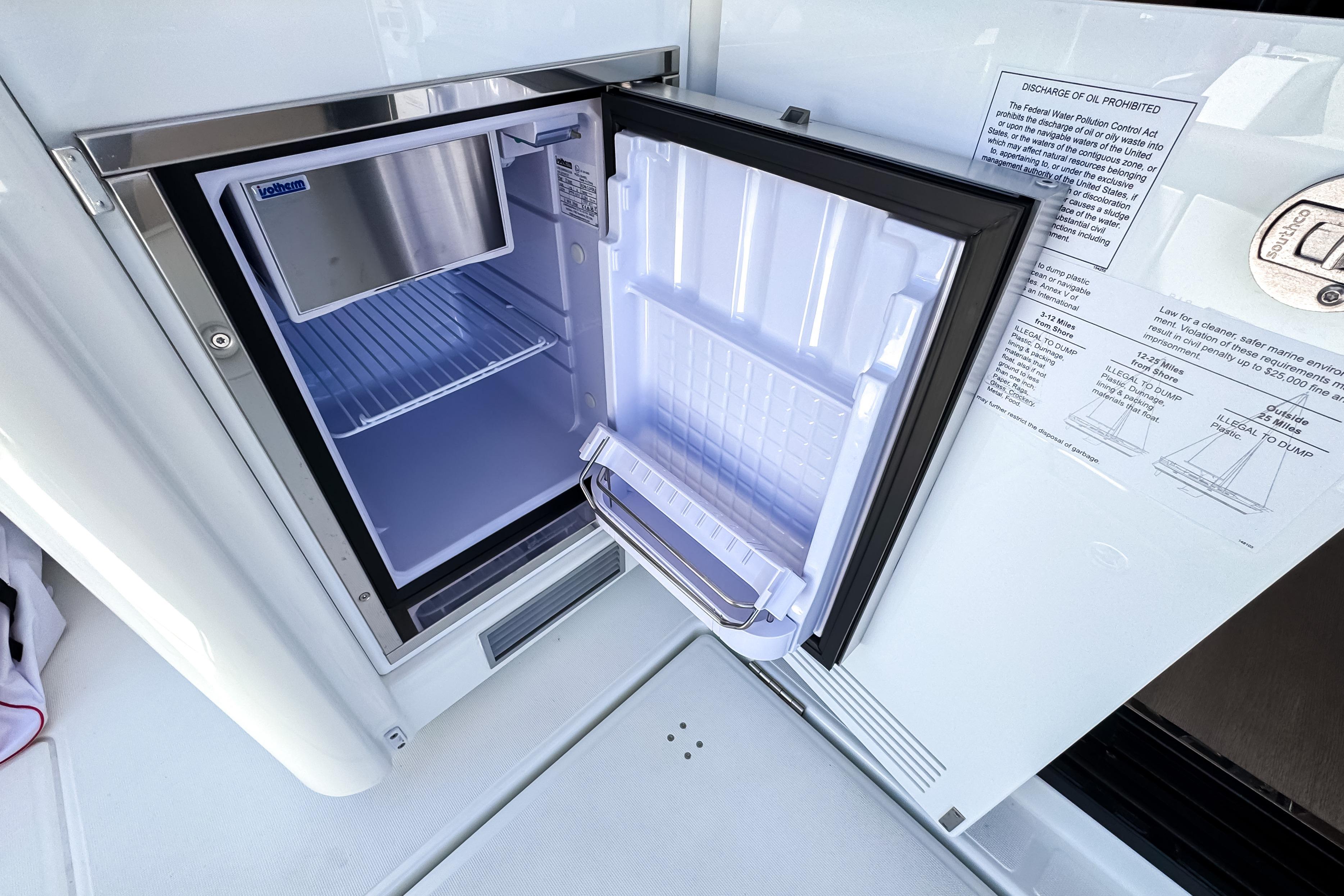 Open refrigerator on Wellcraft 44 Explorer yacht, model year 2026.