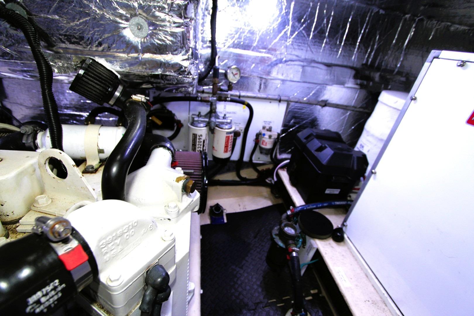 Engine room of a 2002 Nordic Tug 37, featuring mechanical components and insulation.