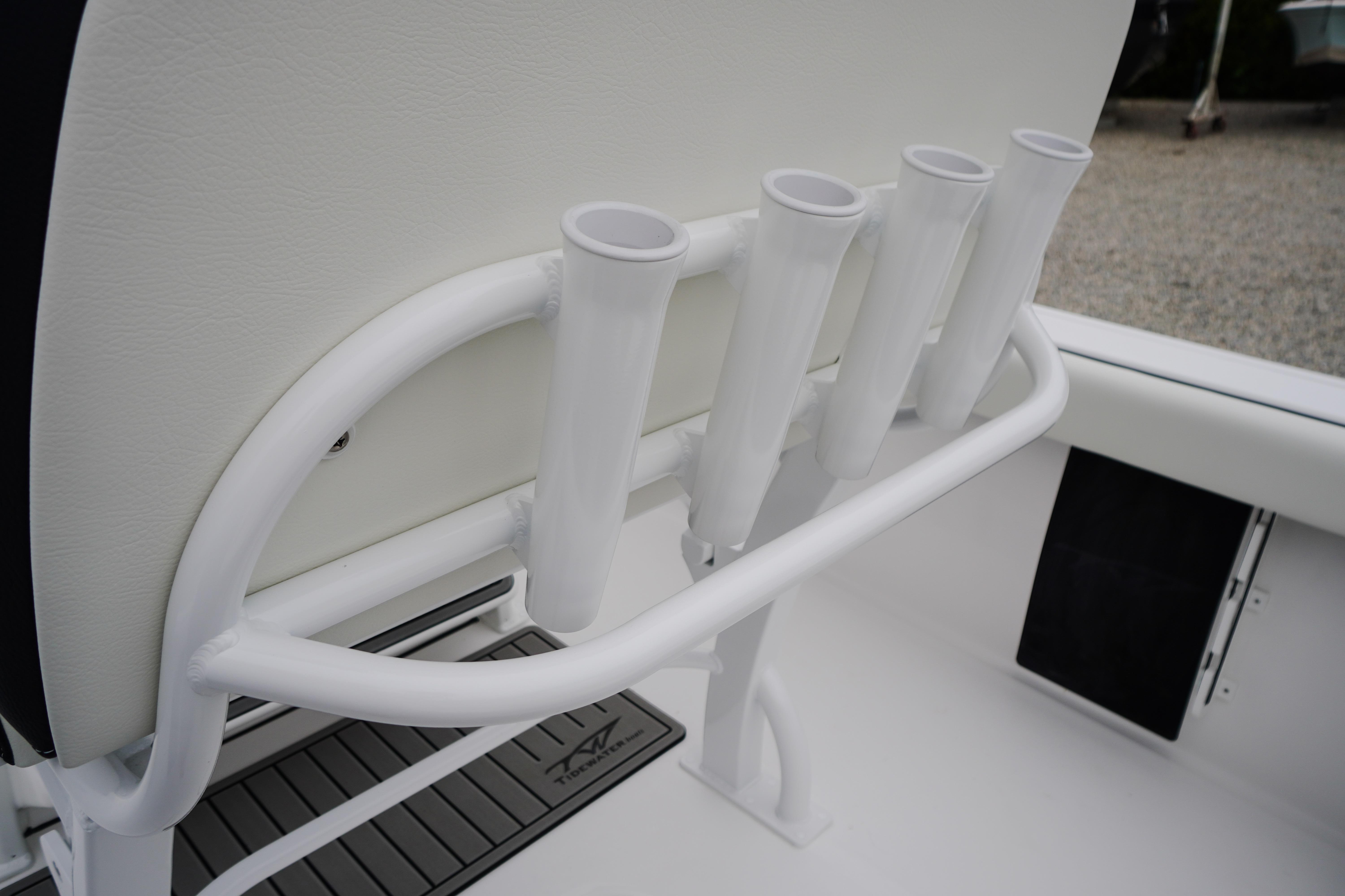 Rod holders on a 2026 Tidewater 232 SS boat, featuring sleek white design.