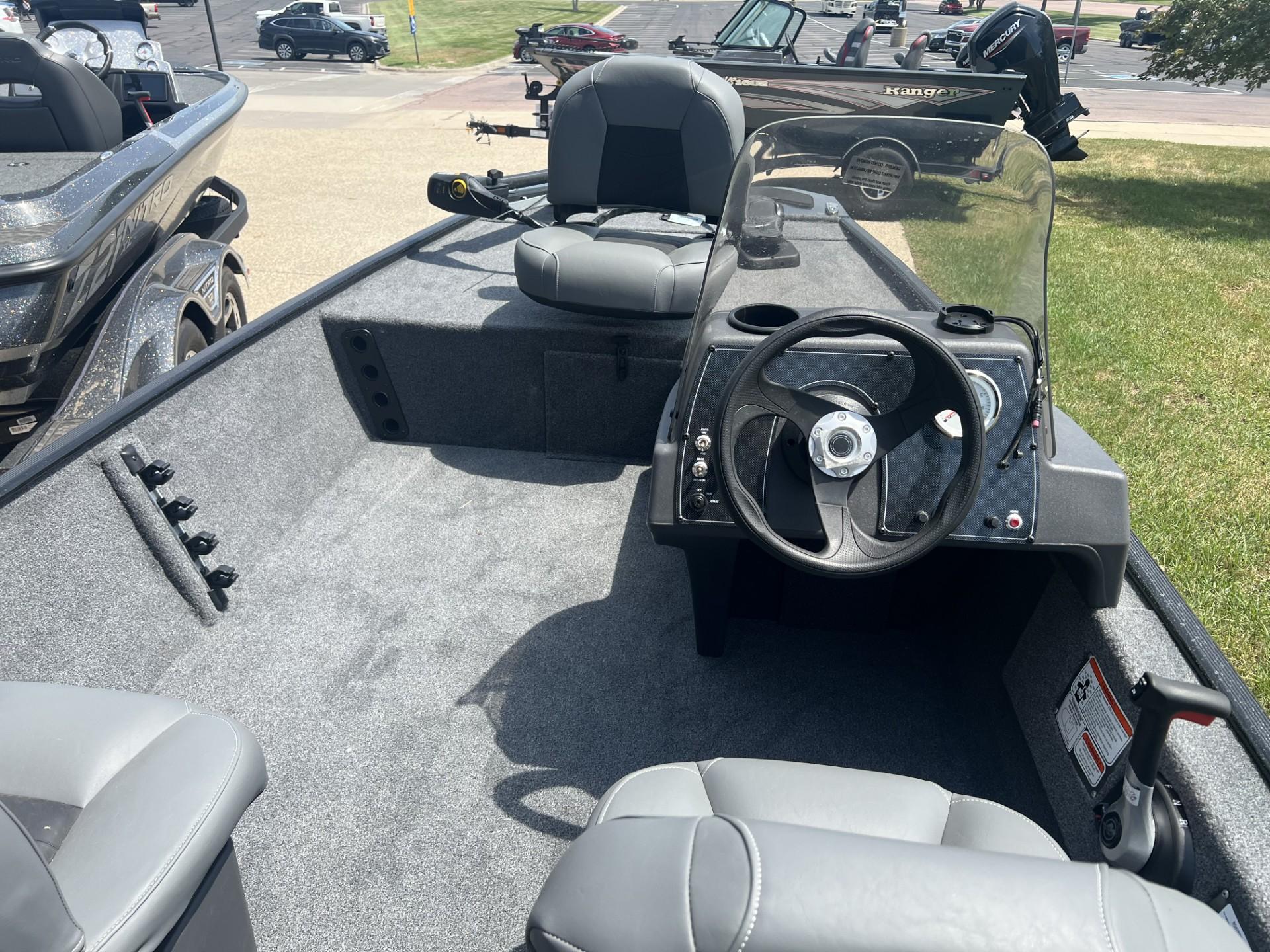 2025 Tracker Bass Tracker Classic XL boat interior with steering wheel and seating.