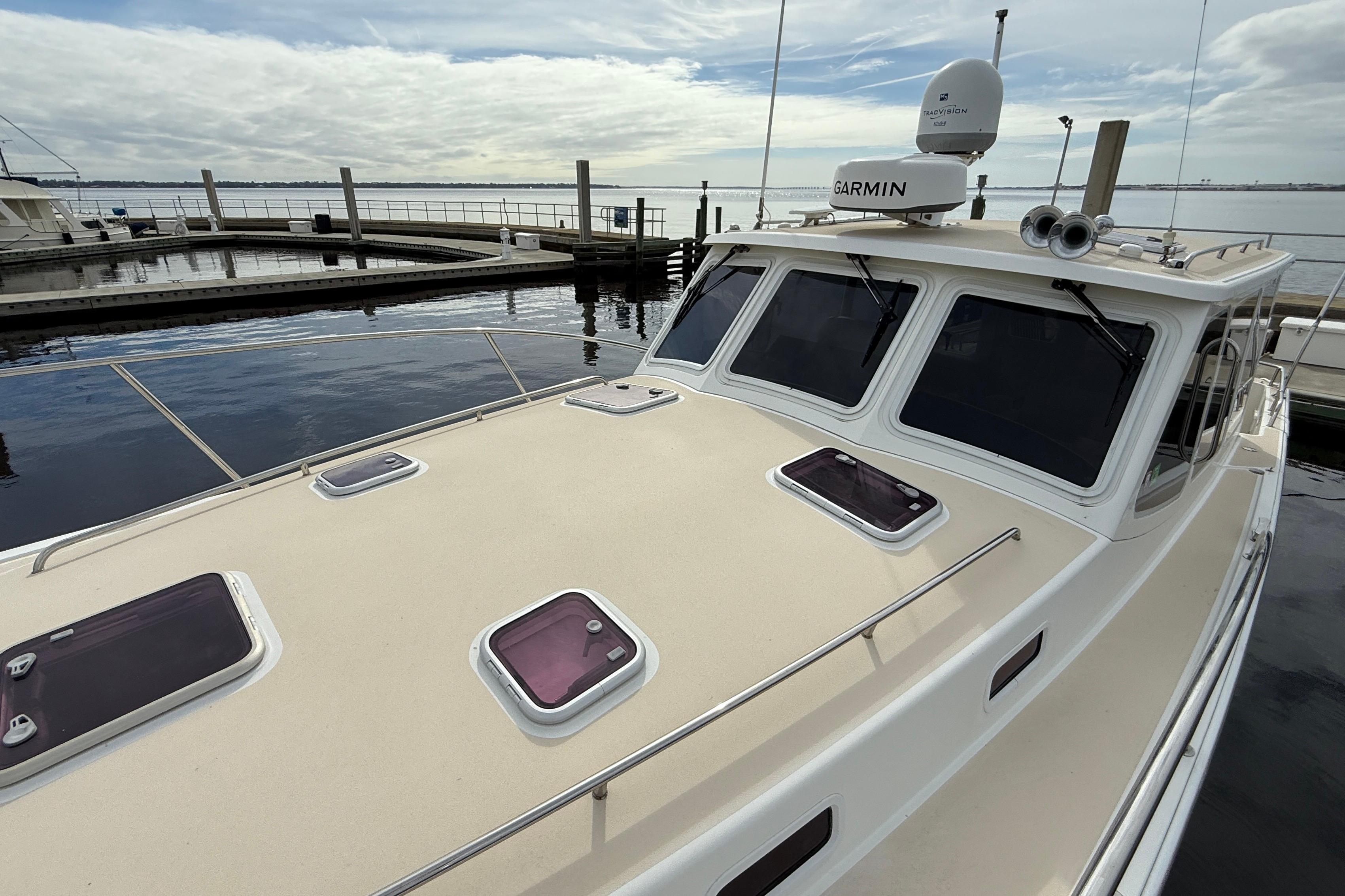 2012 MJM 40z yacht docked, featuring Garmin navigation equipment and multiple deck hatches.
