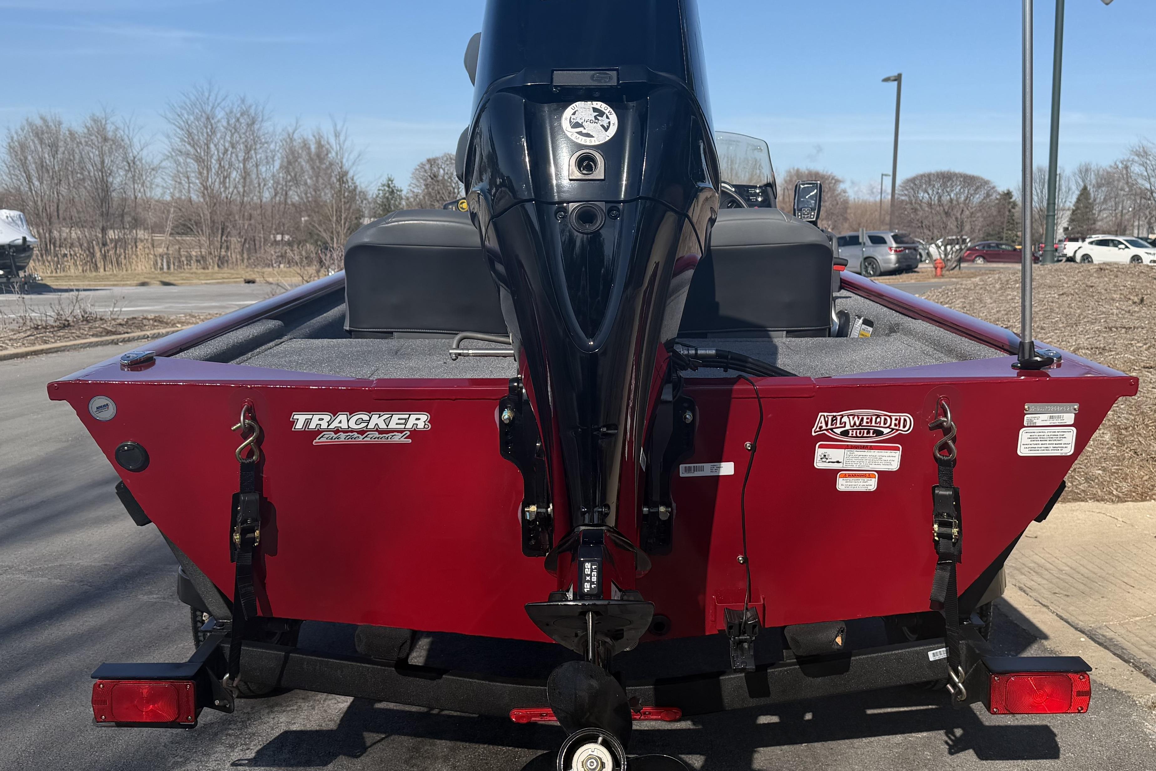2026 Tracker Pro 170 boat, red exterior, parked outdoors, rear view.