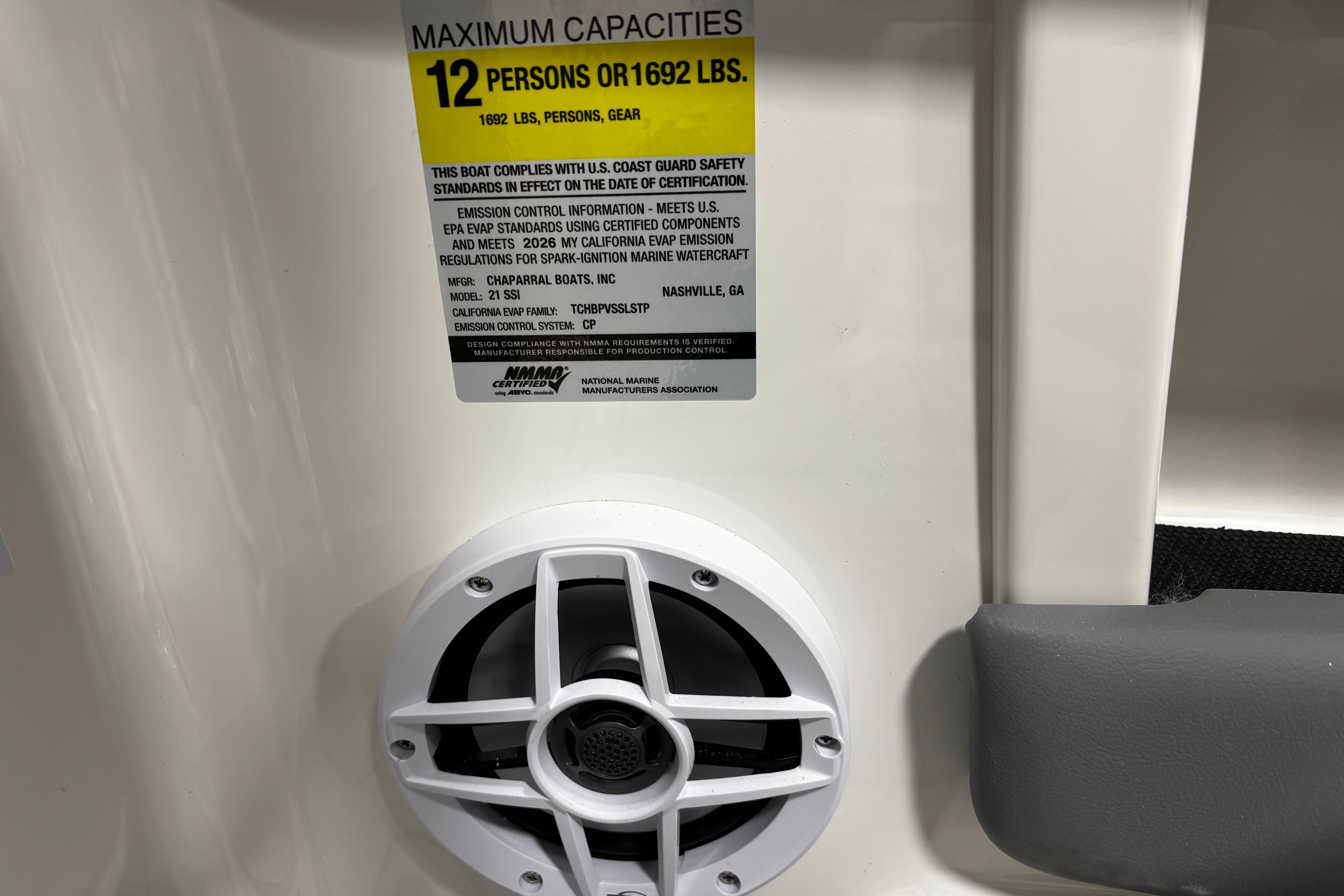 2026 Chaparral 21 SSi boat capacity label, 12 persons or 1692 lbs, compliance details.
