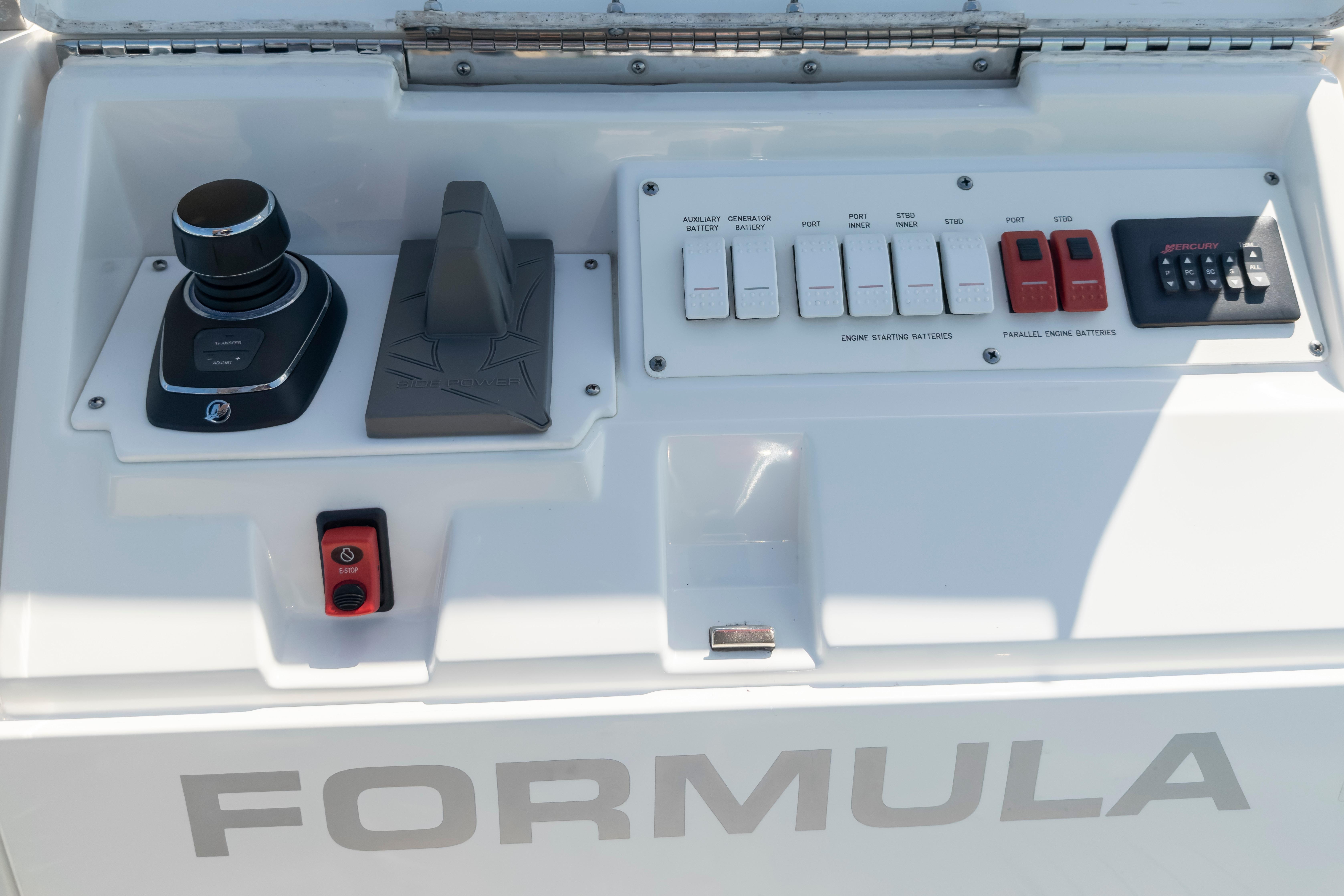 Control panel of 2022 Formula 500 Super Sport Crossover boat with joystick and switches.