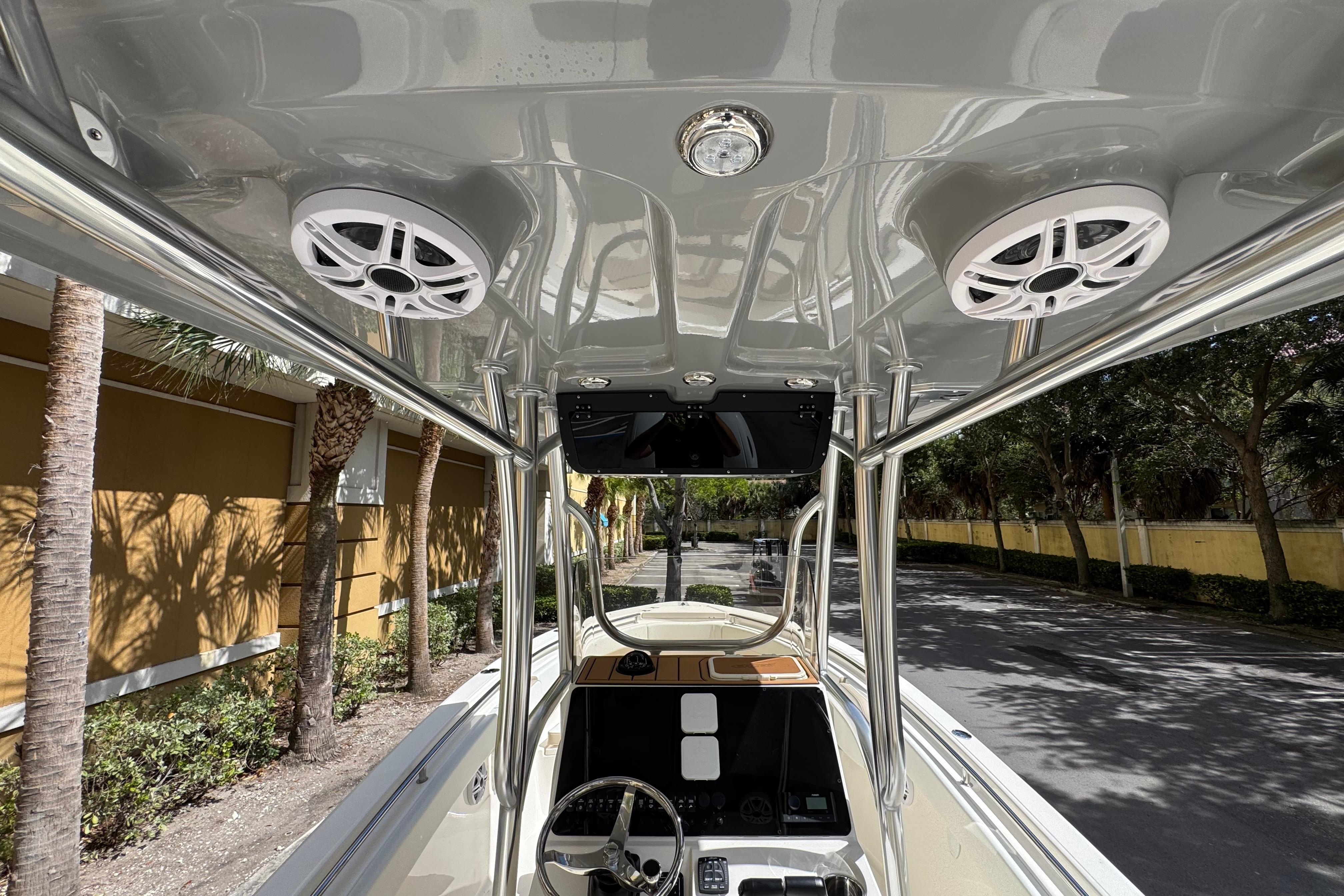 2026 Bulls Bay 255CC boat interior with speakers and steering wheel, showcasing modern design.