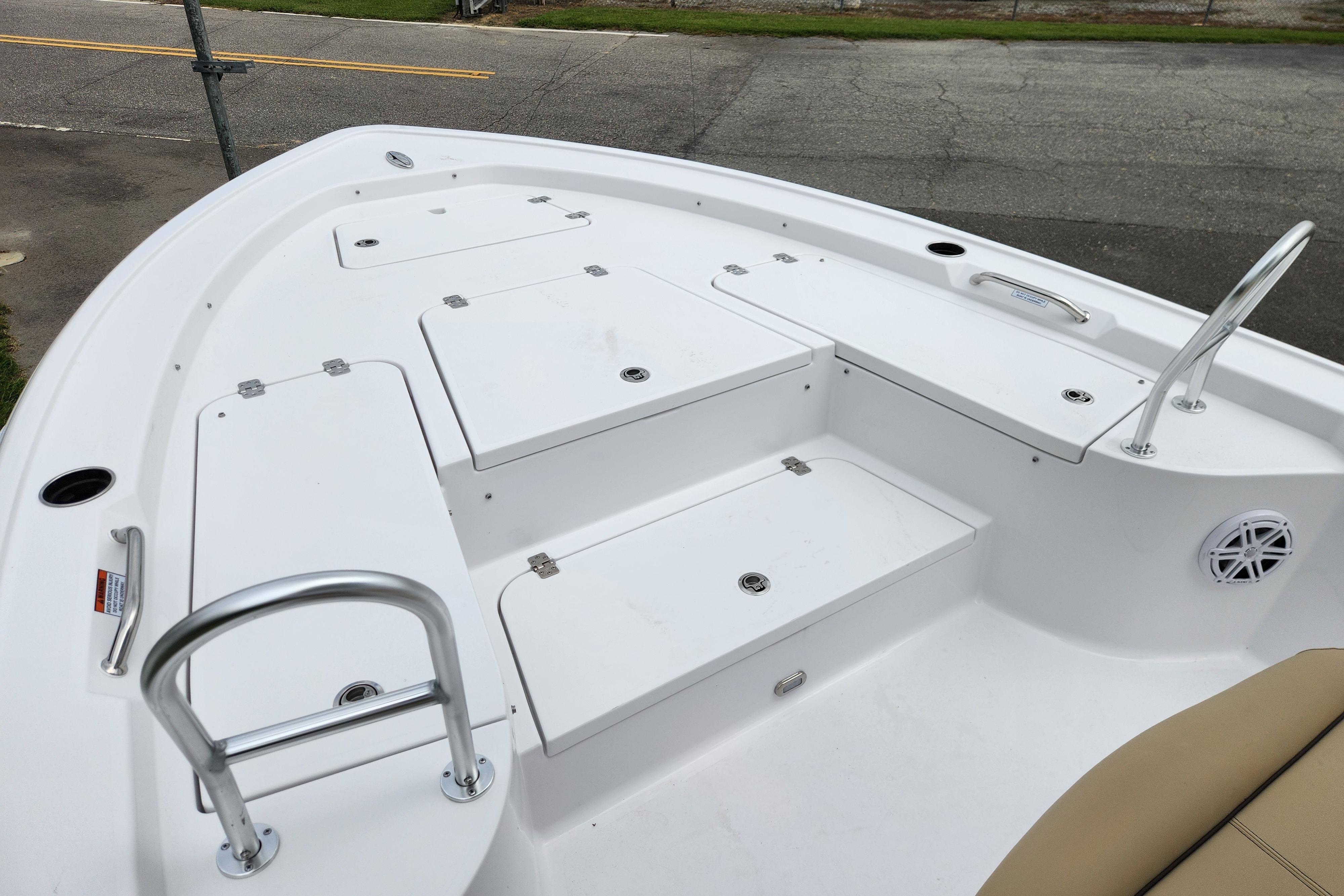 2026 Sportsman Masters 247 Bay Boat deck with storage compartments and seating.