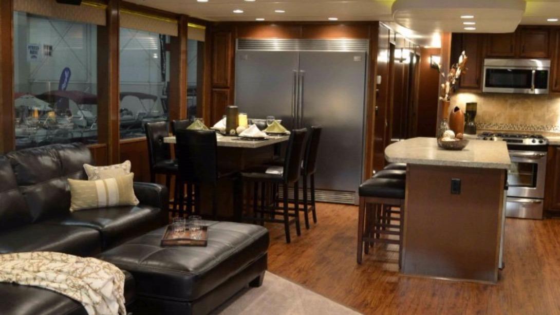 Luxurious interior of 2012 Bravada Ho'okipa Trip 13 with modern kitchen and seating area.