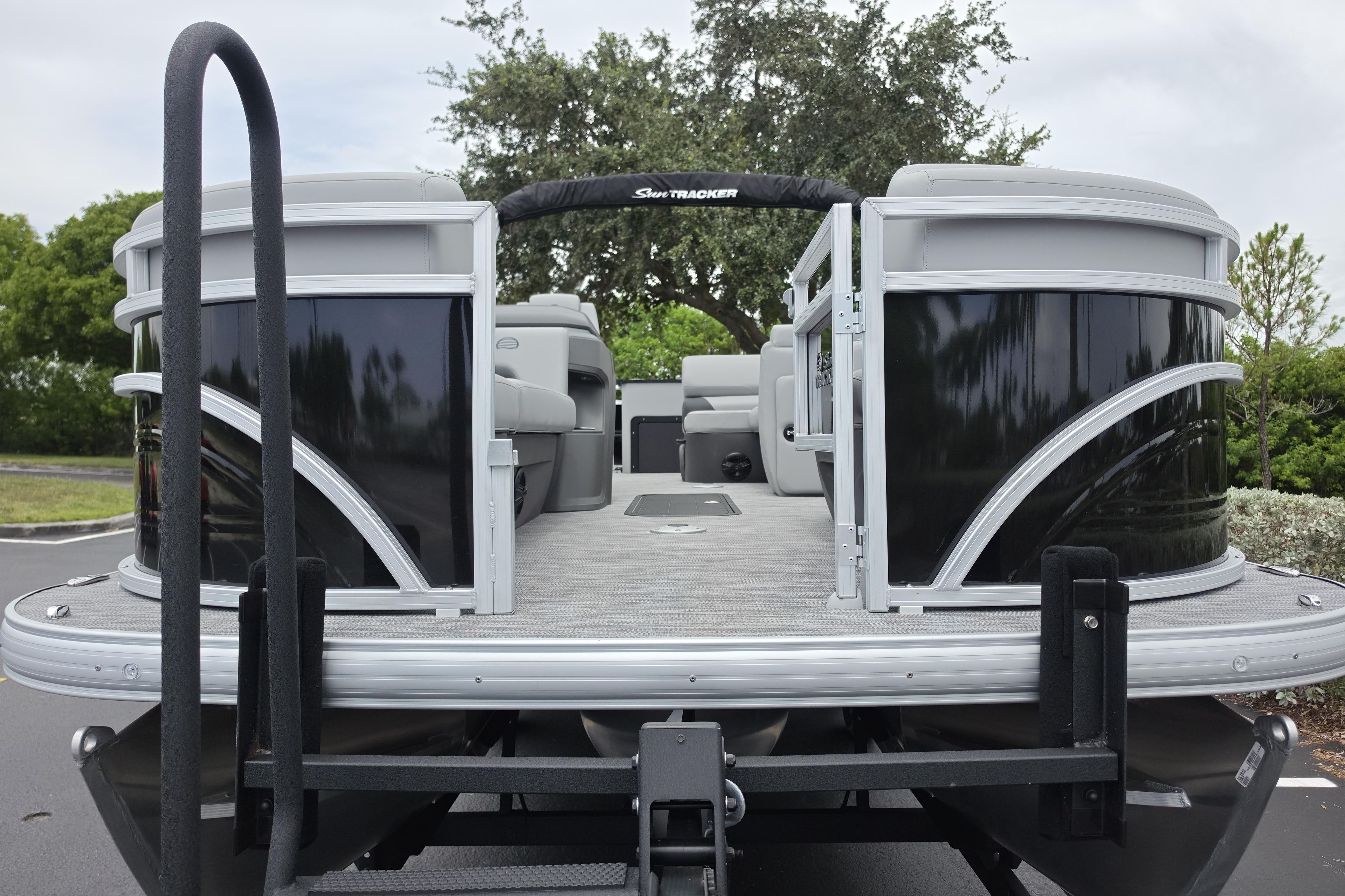 2026 Sun Tracker SportFish 22 XP3 pontoon boat, rear view, on a trailer.