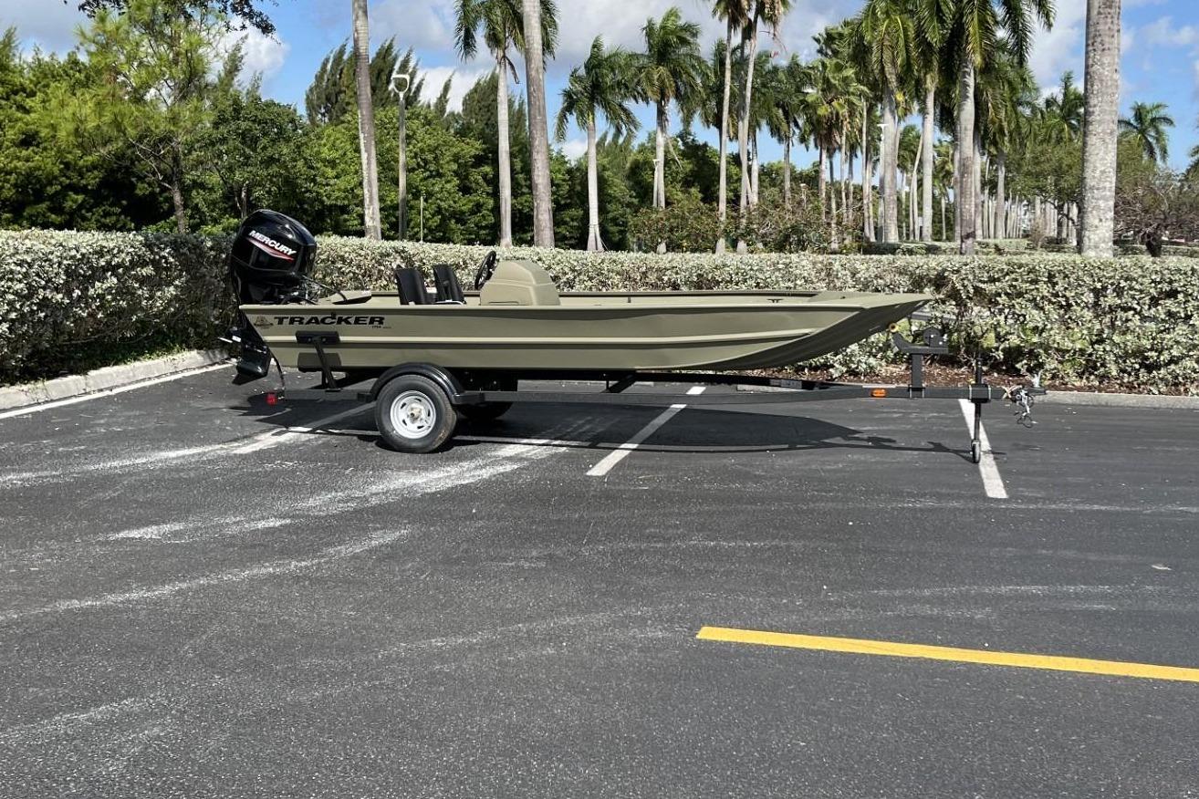 2026 Tracker Grizzly 1754 SC boat parked on trailer outdoors.