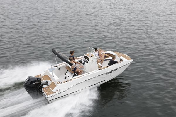2025 Starcraft SVX 211 OB CC boat cruising on open water with passengers.