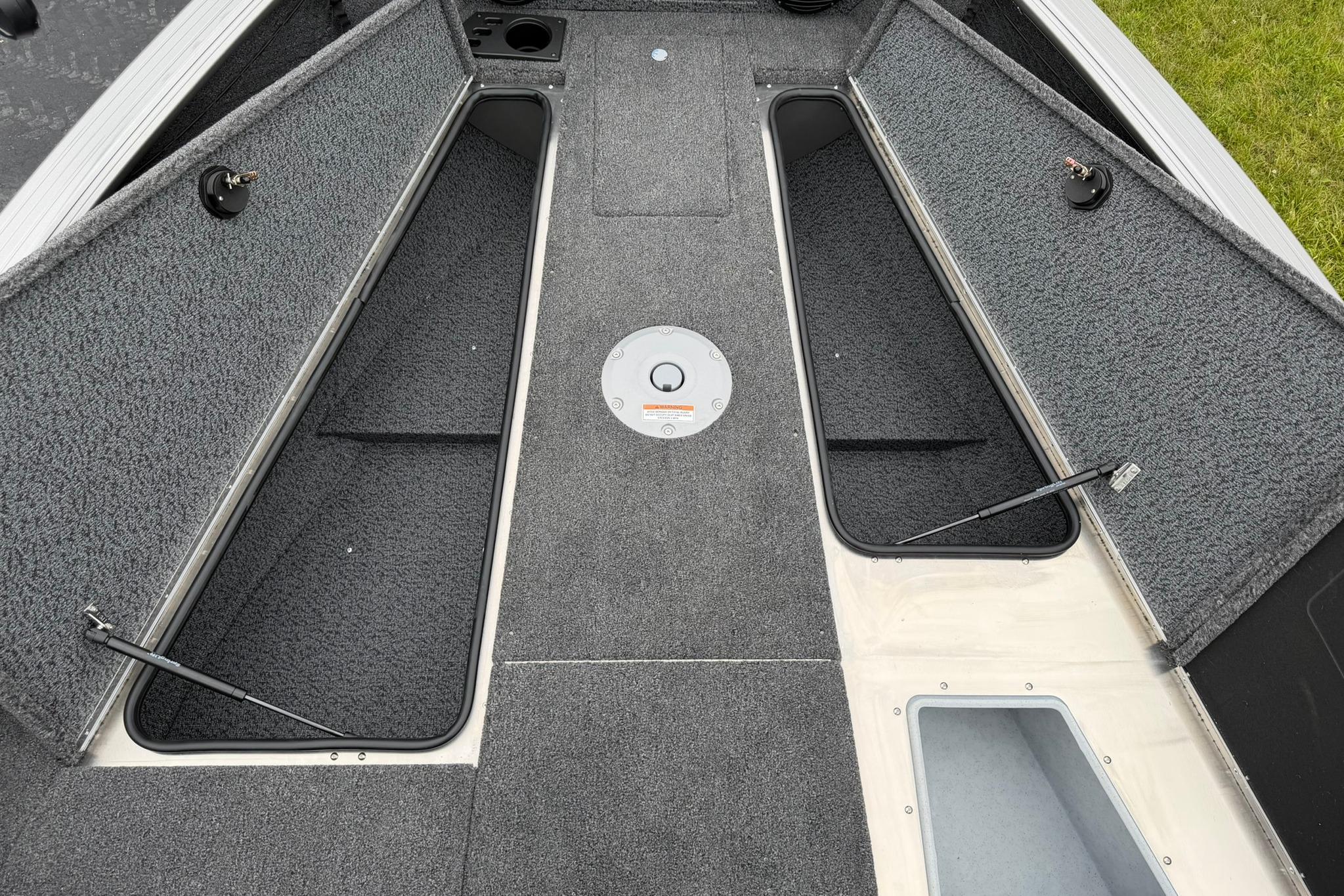 2027 Lund 2075 Impact XS boat interior with open storage compartments.