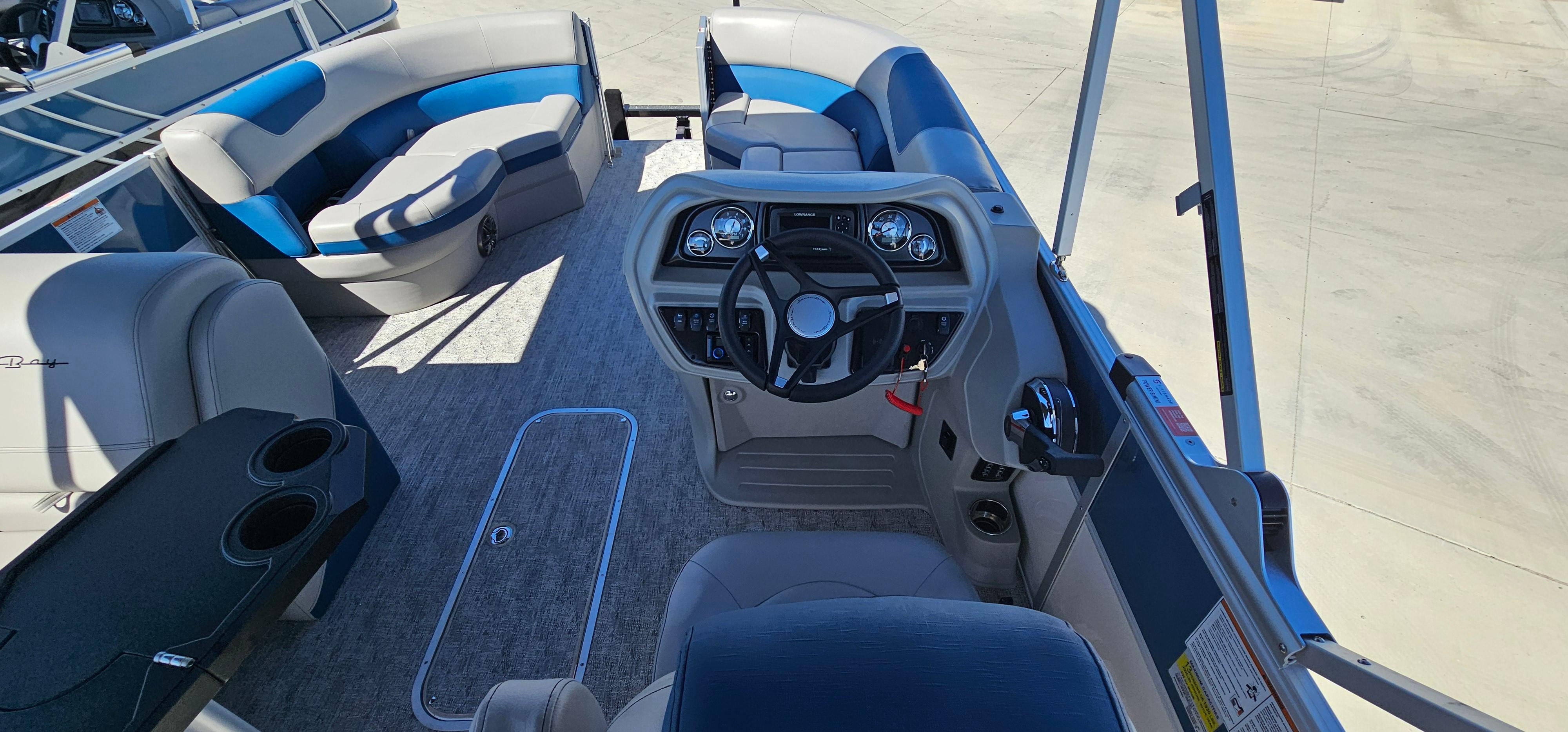 2025 South Bay 224FCRLE pontoon boat interior with helm and seating.