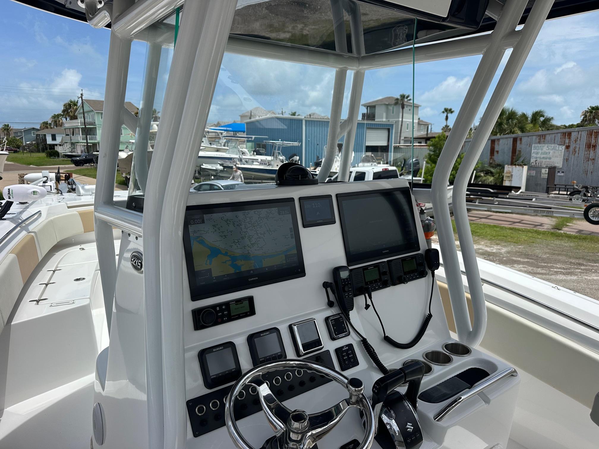 2023 Cape Horn 32xs boat dashboard with navigation screens and controls.