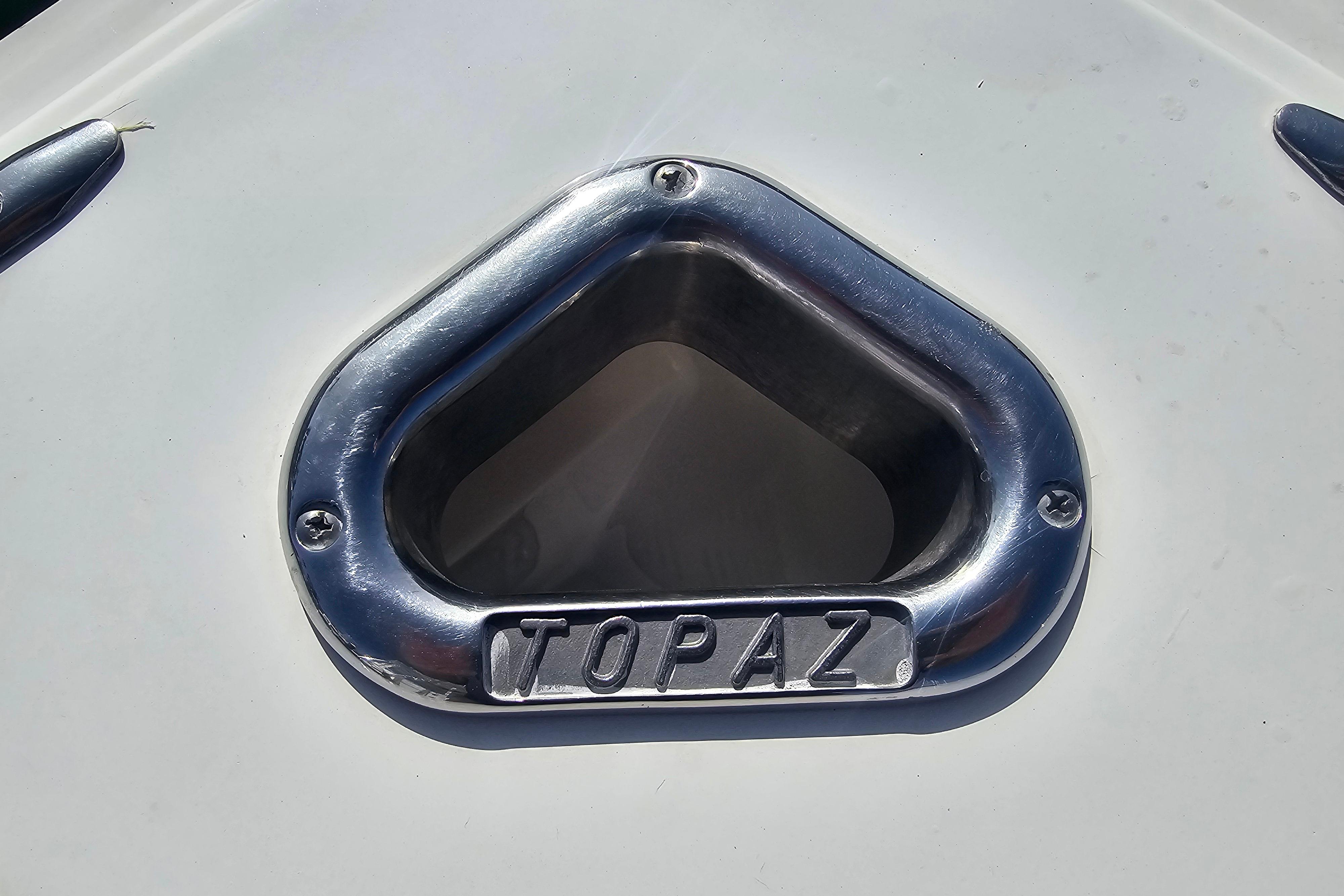 Close-up of 2003 Topaz 32 Express boat's chrome vent detail.