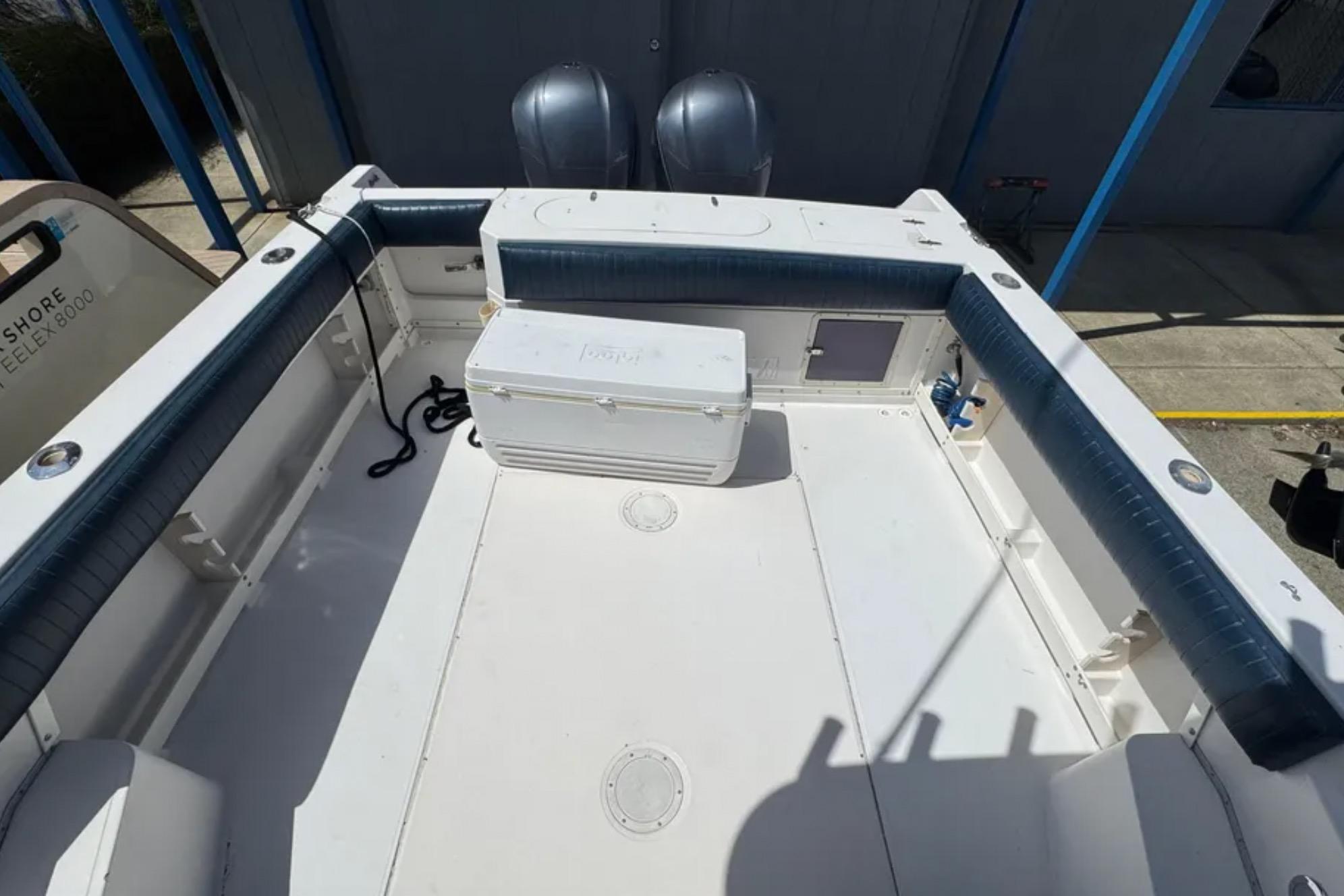 1990 Grady-White Marlin 280 boat deck with seating and storage.