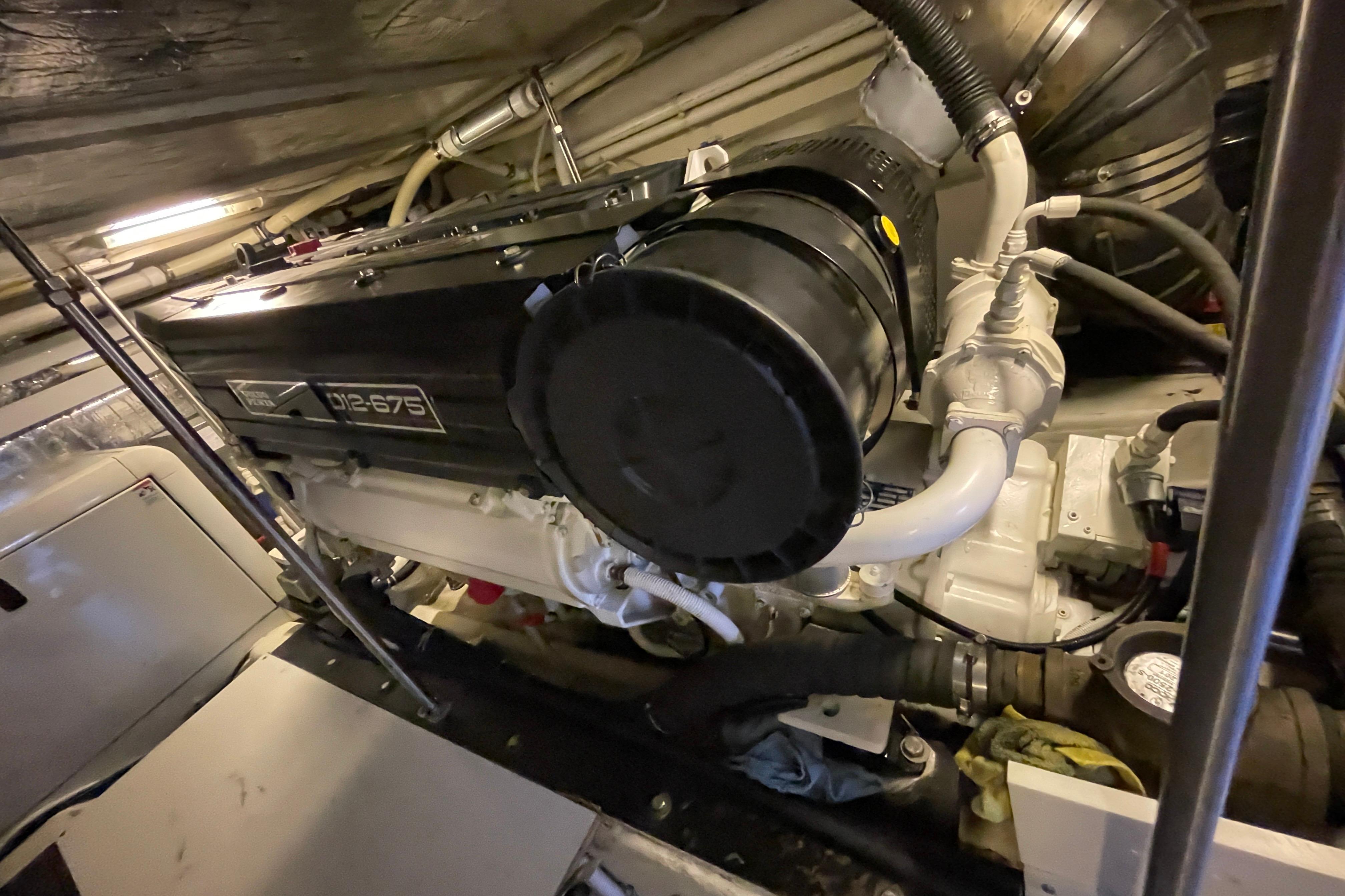 Engine room of 2002 Carver 570 Voyager Pilothouse with V12-675 engine.