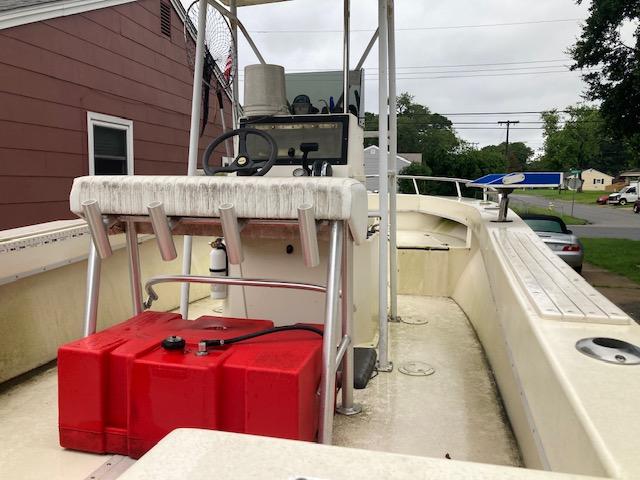 1995 KenCraft Challenger 190 boat with red fuel tank and steering console.