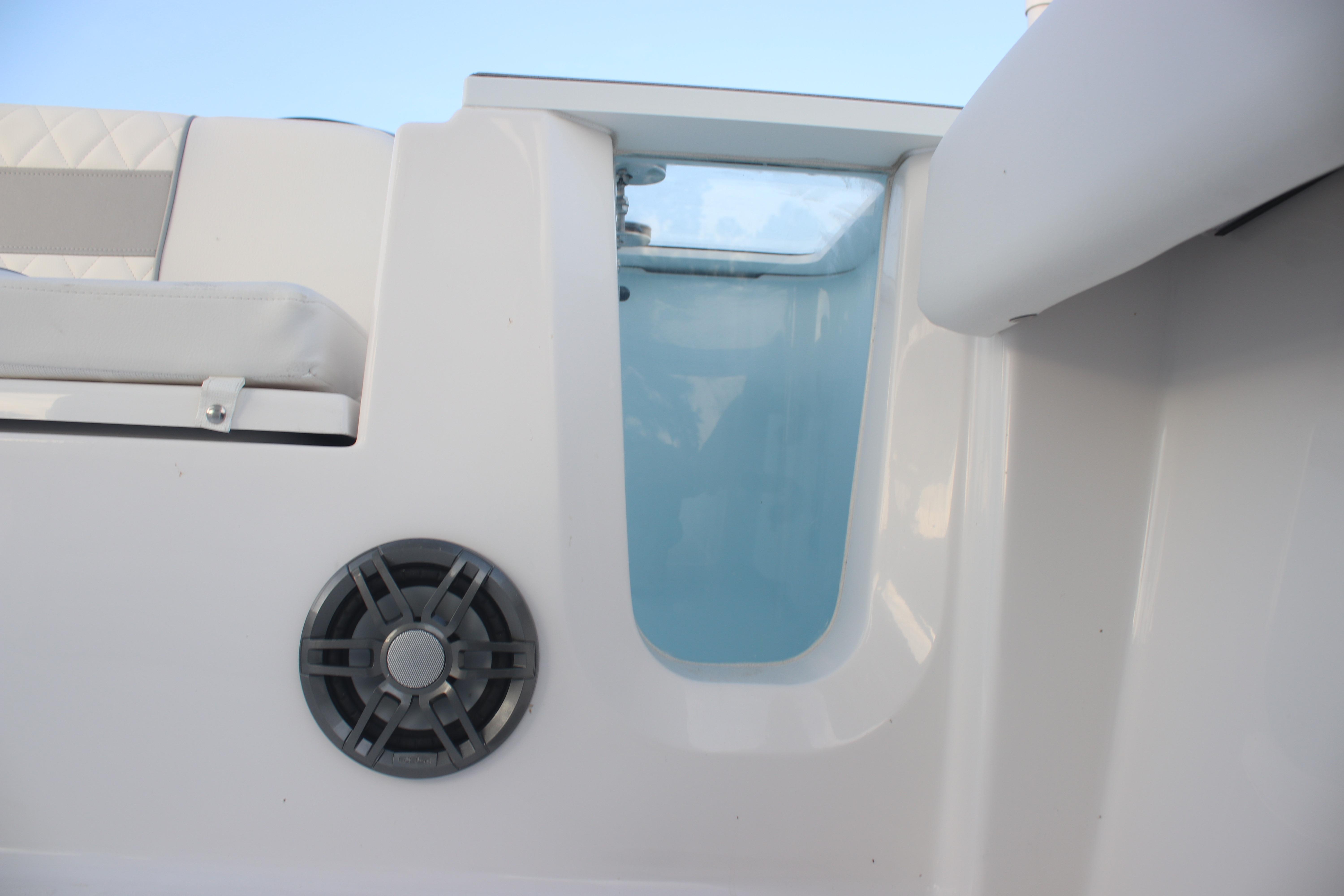 2026 Sea Fox 228 Commander boat interior with speaker and seating detail.