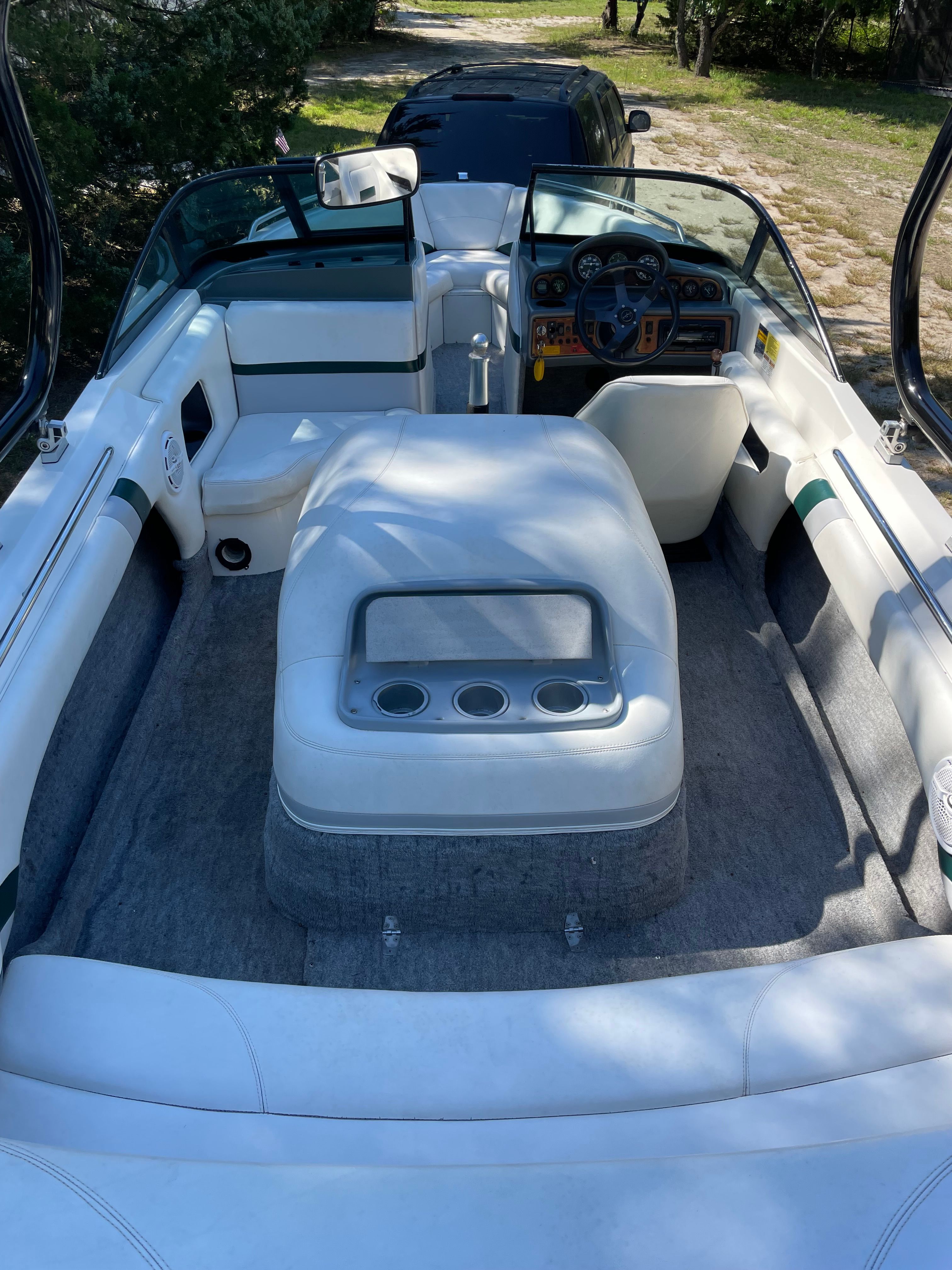 Interior of a 1997 MasterCraft Prostar 205 boat, white seating.