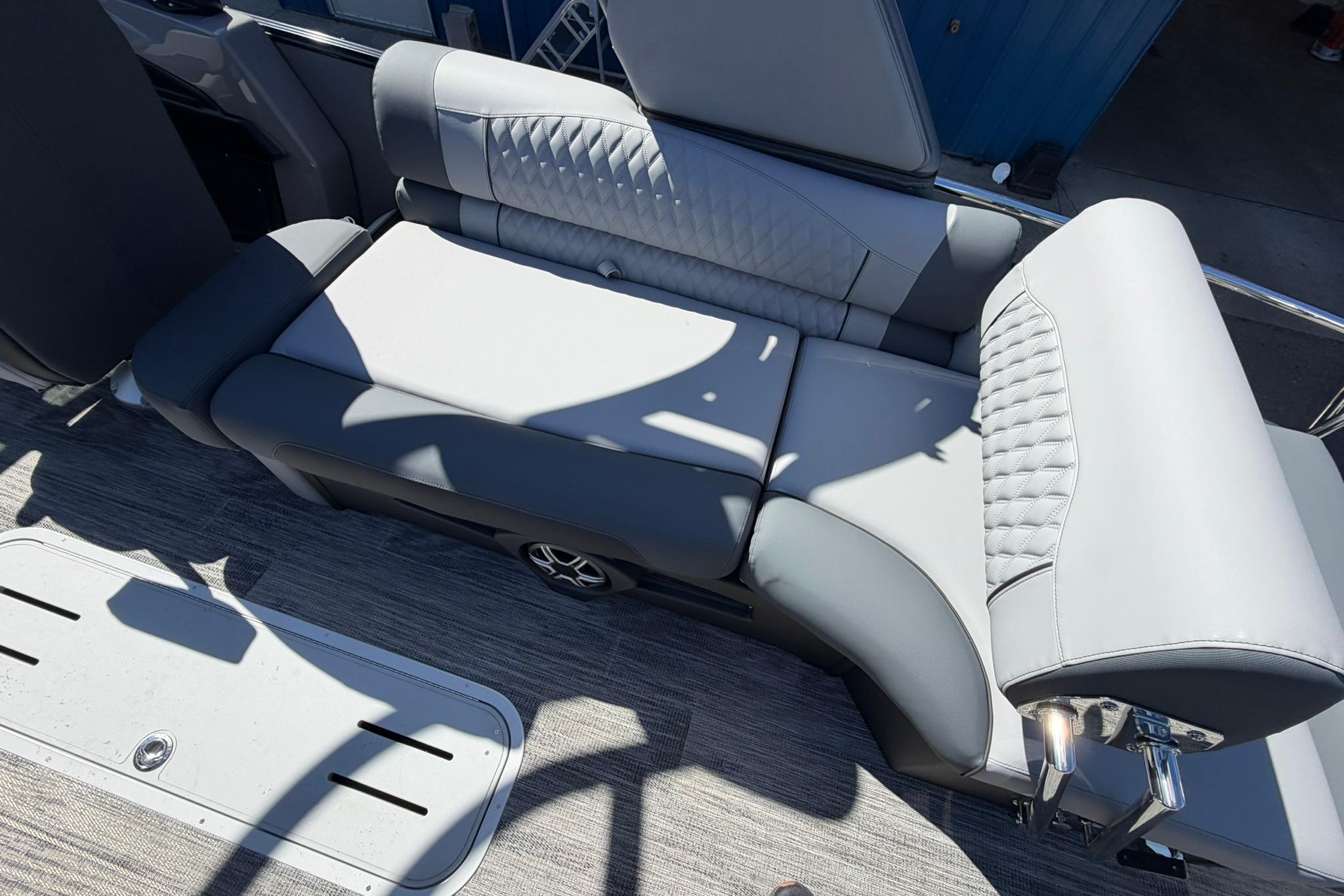 Luxurious seating on 2026 Avalon Excalibur LTD Quad Lounge Windshield boat, featuring elegant upholstery.
