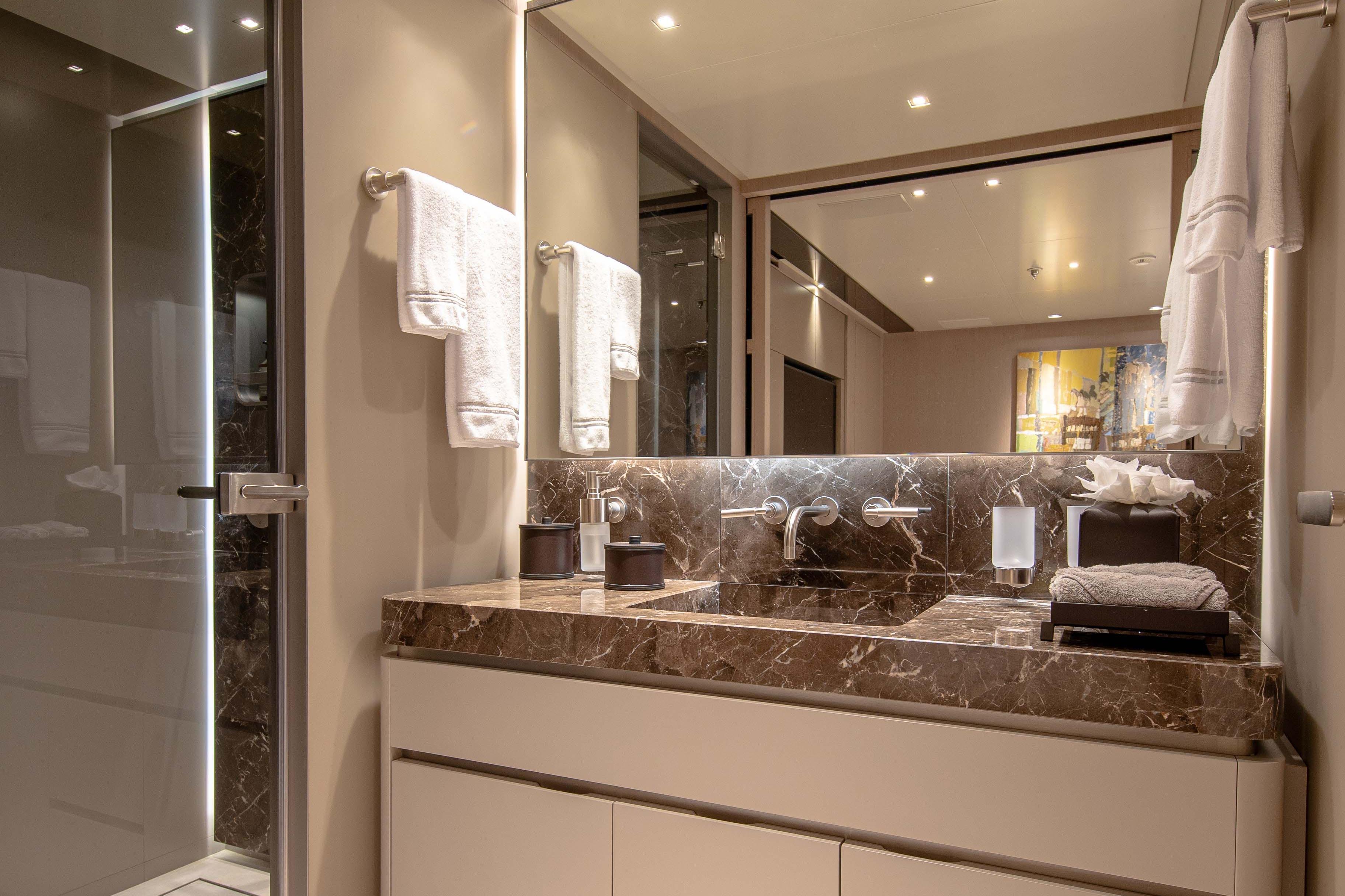 Luxurious bathroom in 2022 Tankoa S501 yacht with marble countertop and modern fixtures.