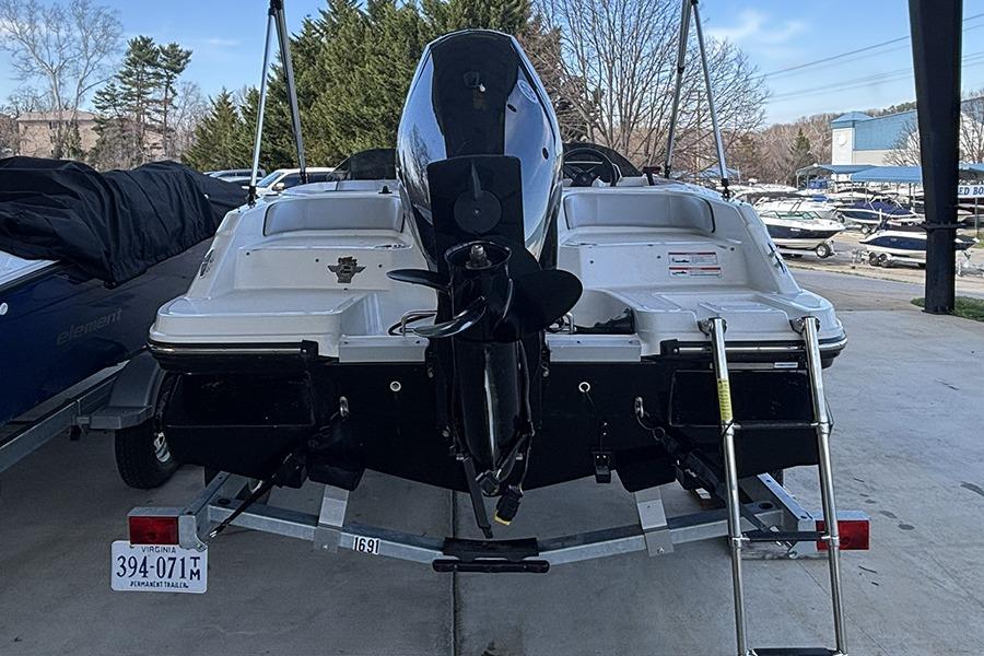 2024 Bayliner Element M17 boat on trailer, rear view with outboard motor.