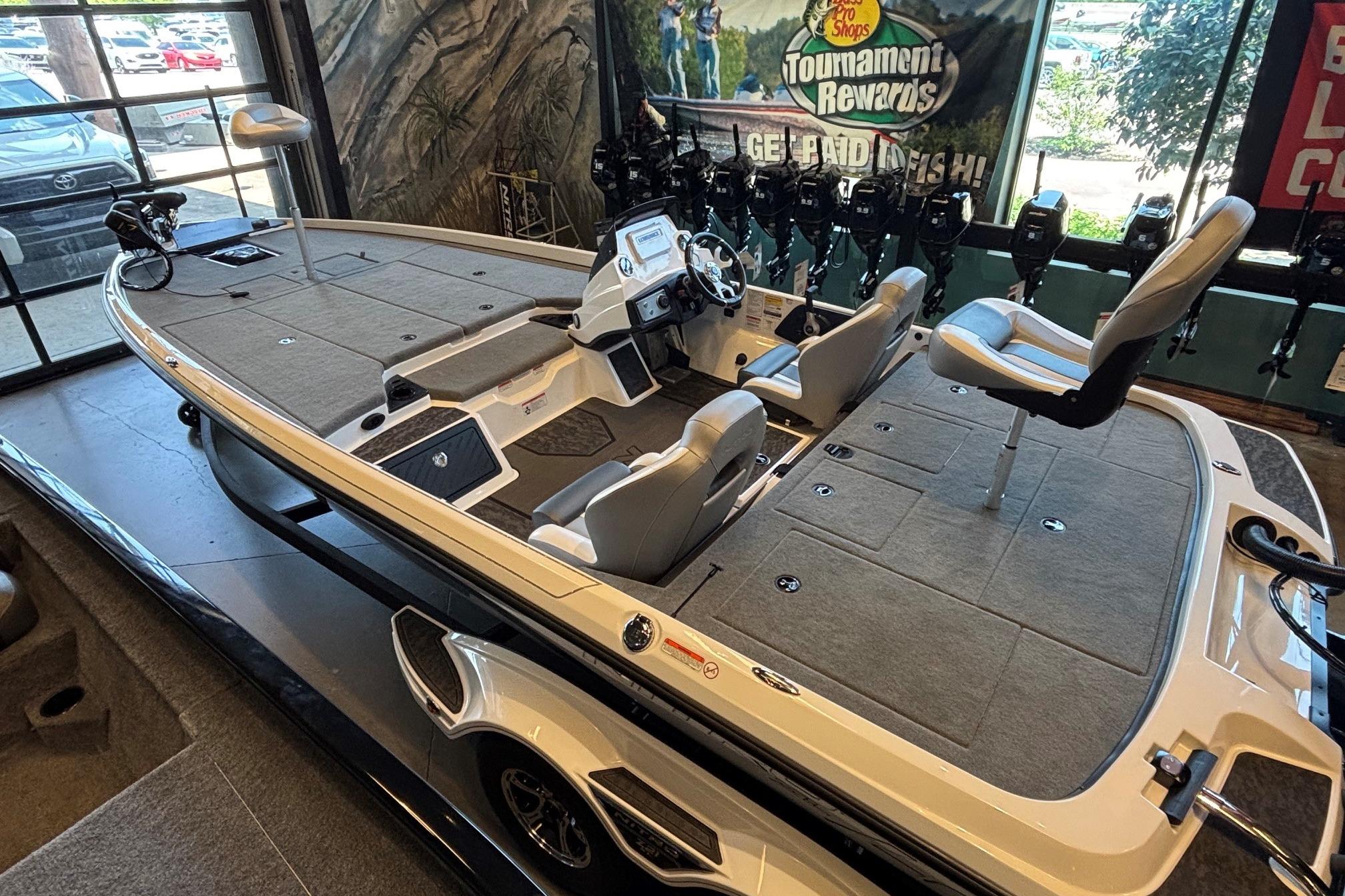 2026 Nitro Z21 XL fishing boat with spacious deck and modern controls in showroom.