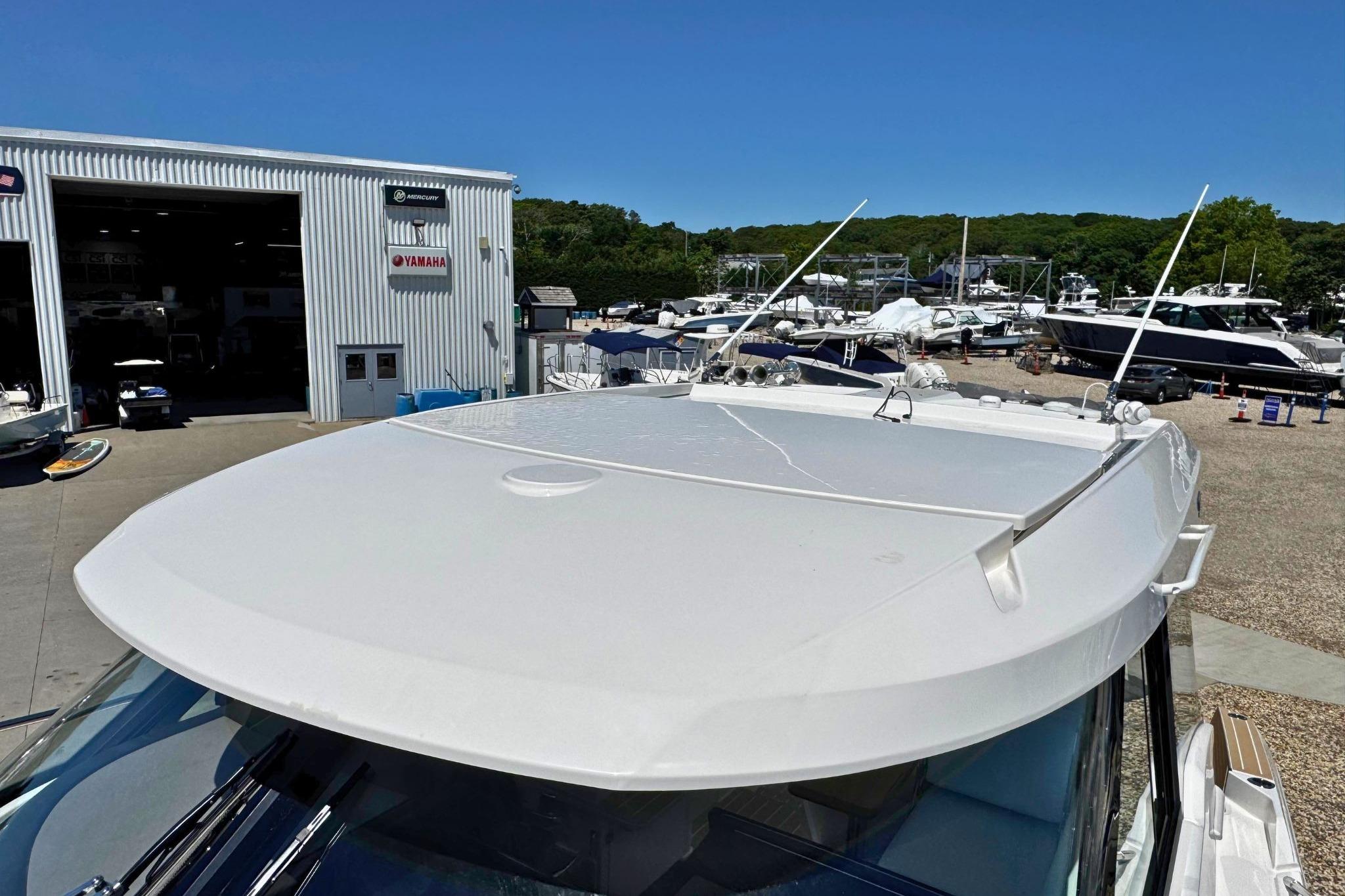 2027 Tiara Yachts 39 LE at marina, showcasing sleek design and modern features.